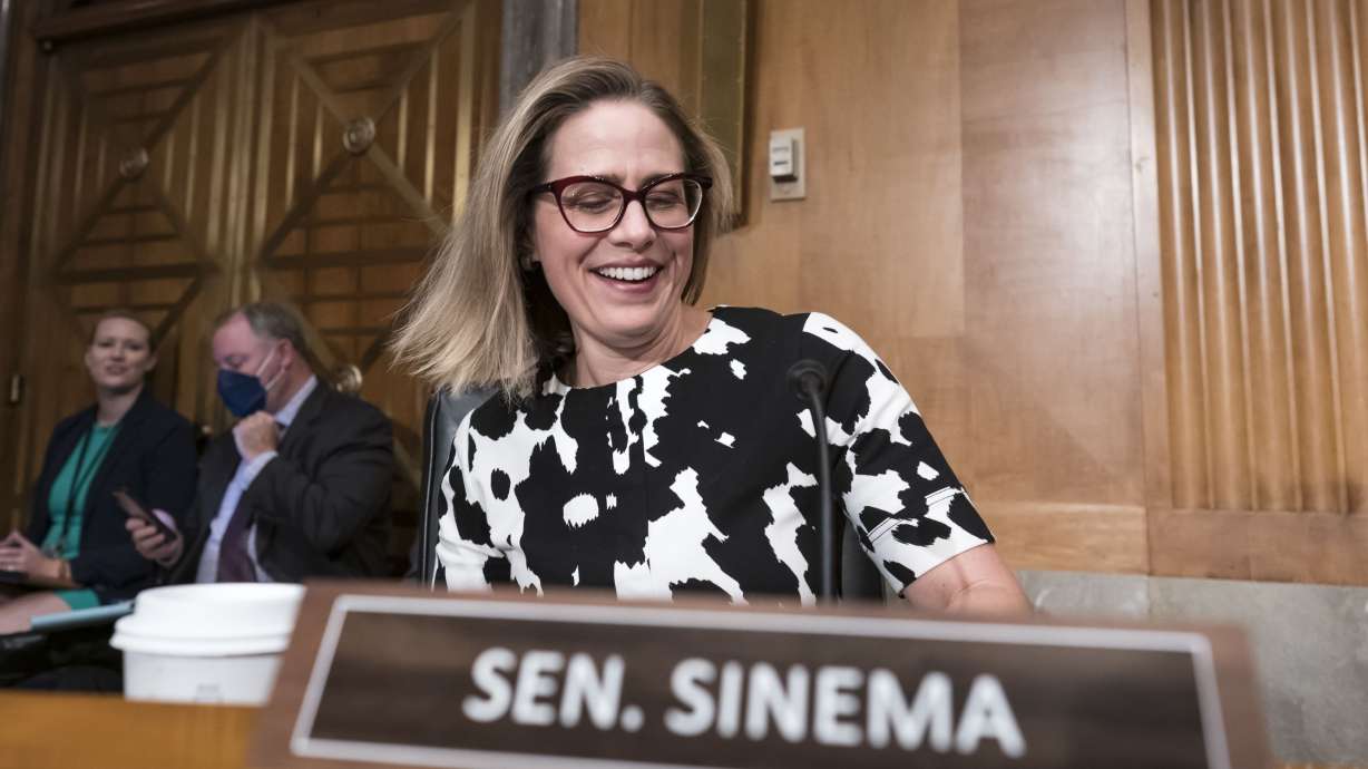 Arizona Sen. Kyrsten Sinema arrives for a meeting of the Senate Homeland Security Committee at the Capitol. Utah Sen. Mitt Romney said he's open to endorsing Sinema if she decides to run for the Senate again in 2024.