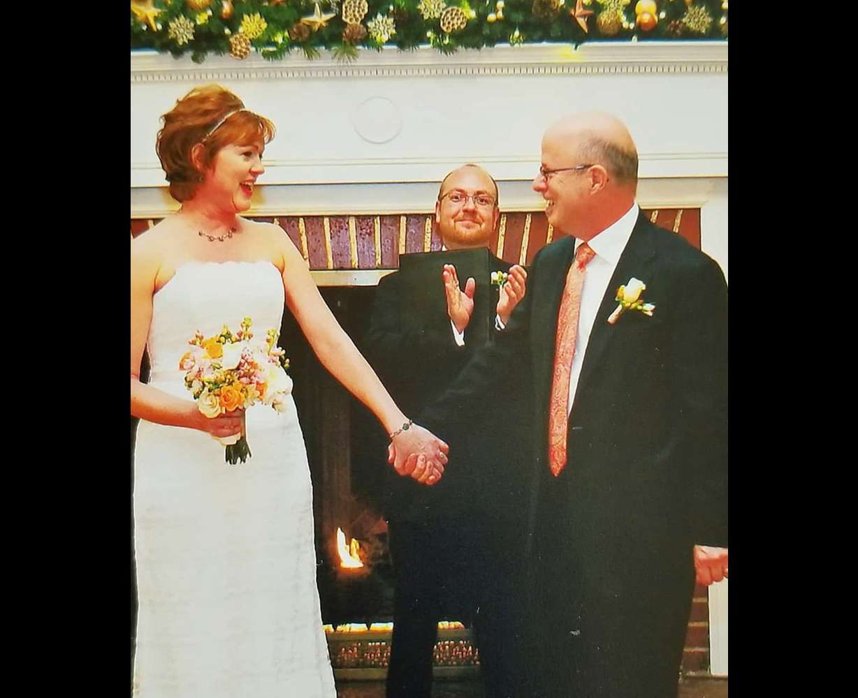Todd Curtis, center, officiates the wedding of Cali and Wylie Gerrard. From kind acts to clean copy, Todd Curtis taught us all just how much the little things matter.