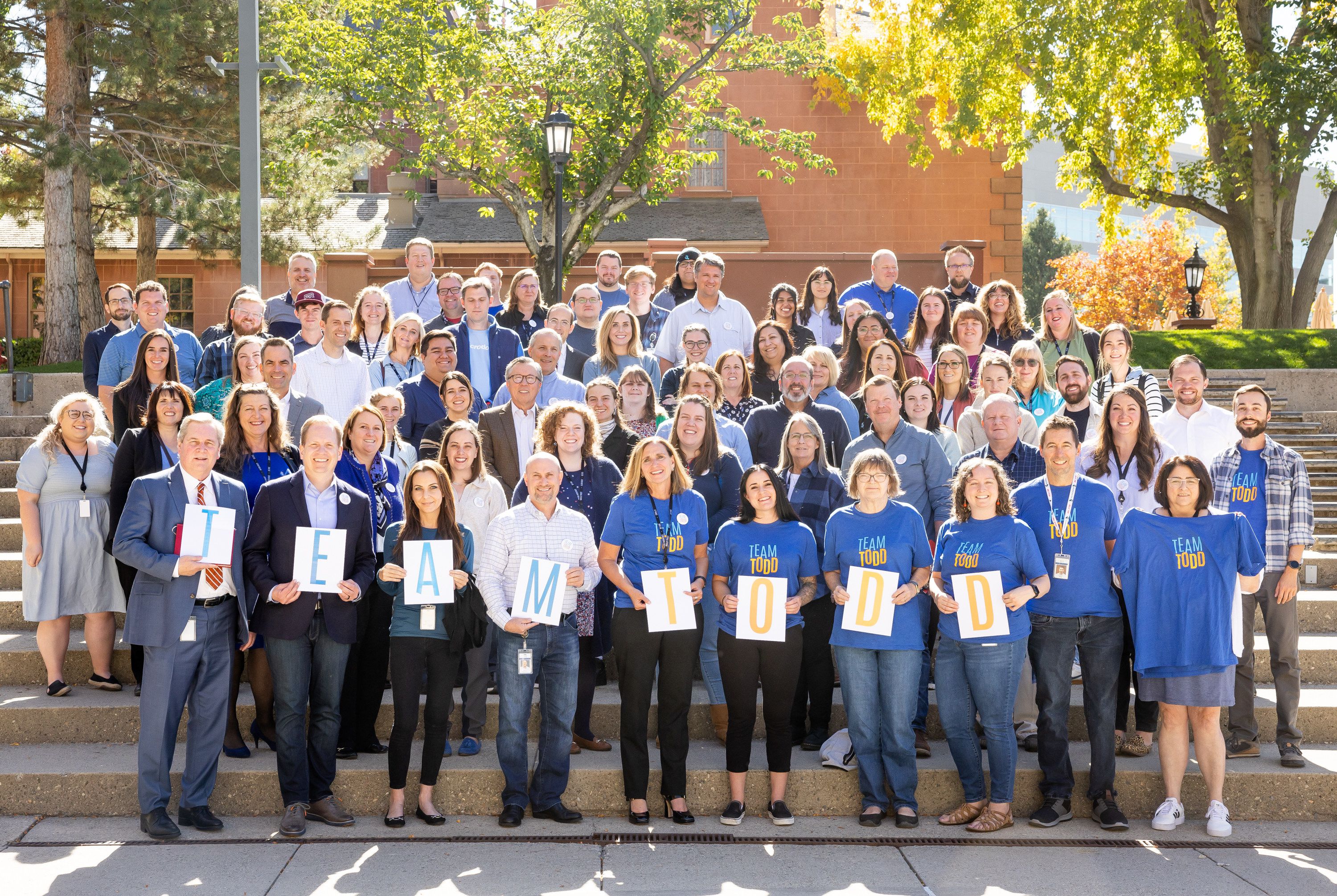 The staff of the Deseret News poses for a photo in support of Copy Desk chief Todd Curtis outside the news organization’s offices in Salt Lake City on Oct. 18, 2022. From kind acts to clean copy, Todd Curtis taught us all just how much the little things matter.