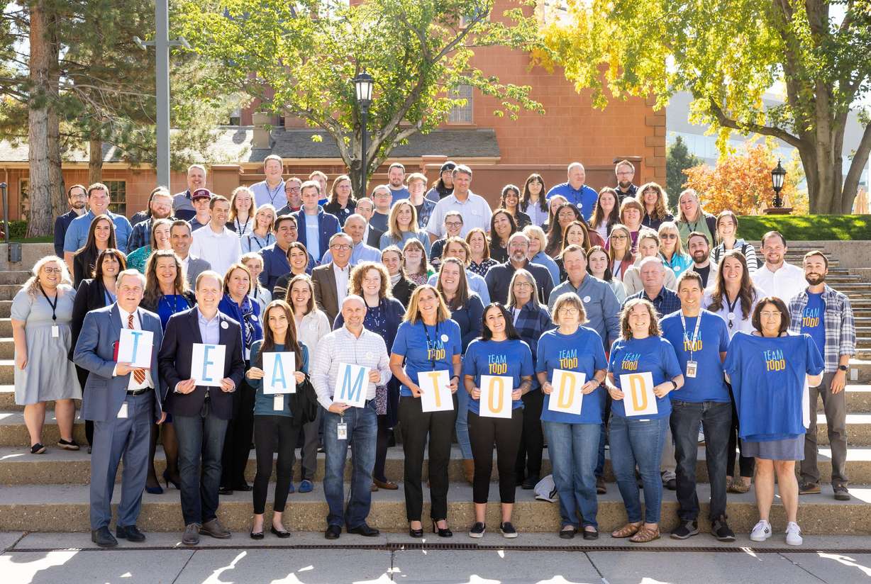 The staff of the Deseret News poses for a photo in support of Copy Desk chief Todd Curtis outside the news organization’s offices in Salt Lake City on Oct. 18, 2022. From kind acts to clean copy, Todd Curtis taught us all just how much the little things matter.