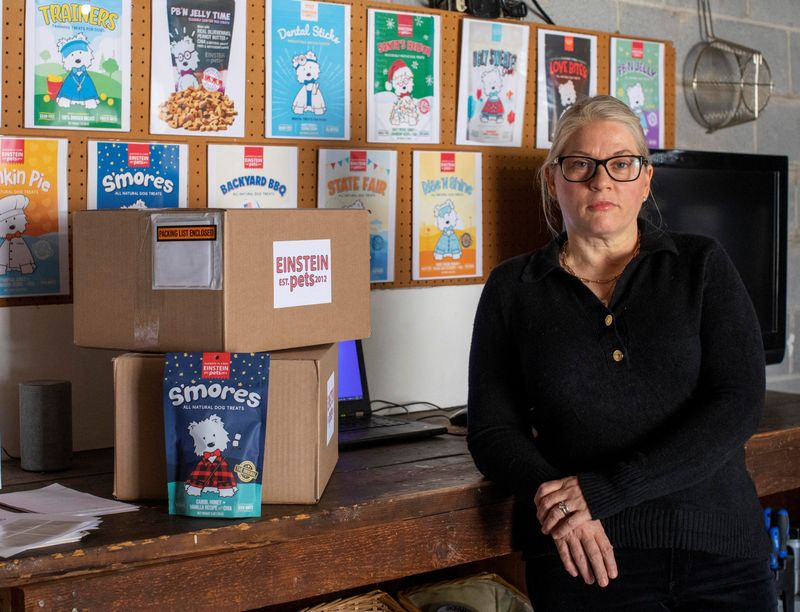 Einstein Pets owner Kelly Ison poses for a portrait near a group of fulfilled orders at her residence in Canton, Georgia, Feb. 8. She moved to protect profit by ending free shipping in mid-2022.