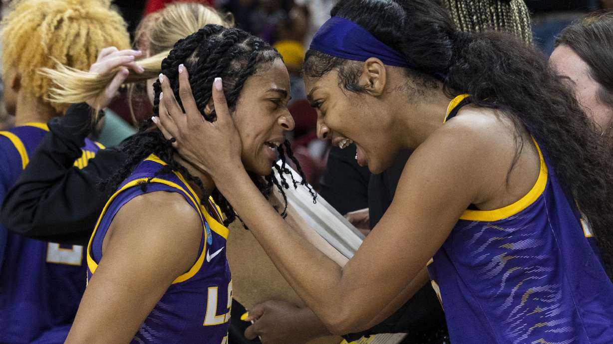 LSU's Angel Reese, at right, hugs teammate Alexis Morris, left, after defeating Utah in a Sweet 16 college basketball game of the NCAA Tournament in Greenville, S.C., Friday, March 24, 2023.