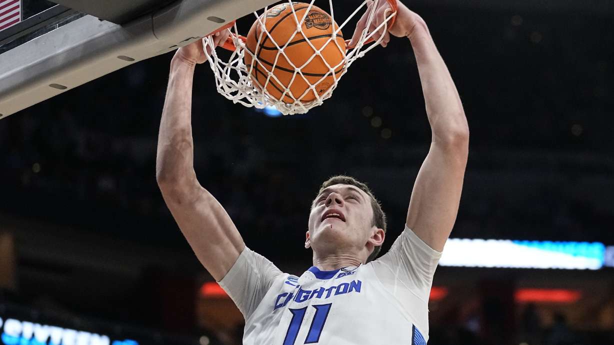 Creighton center Ryan Kalkbrenner (11) makes the dunk against Princeton in the second half of a Sweet 16 round college basketball game in the South Regional of the NCAA Tournament, Friday, March 24, 2023, in Louisville, Ky.