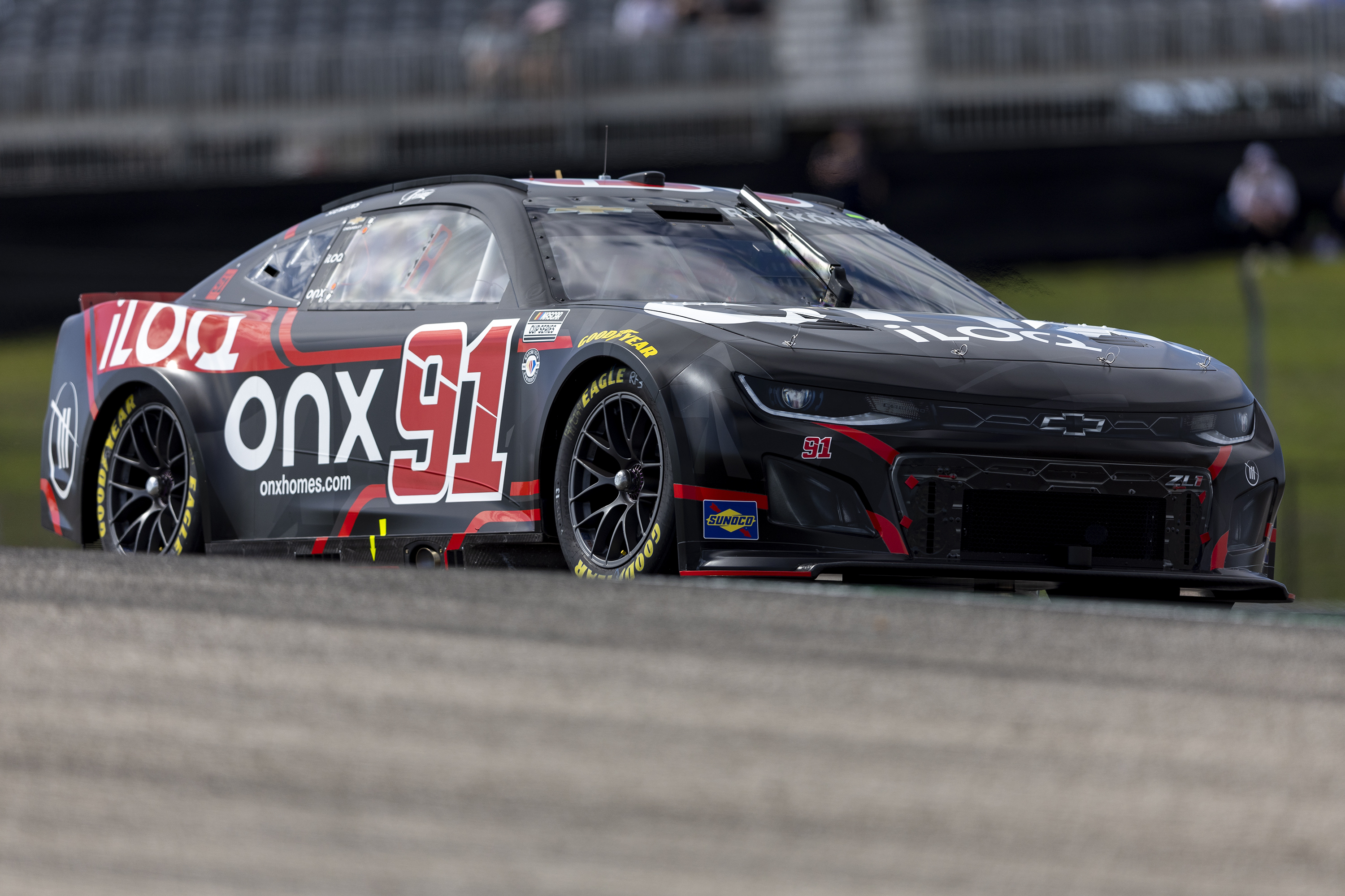 Kimi Raikkonen steers his car through Turn 1 during qualifying qualifying for the NASCAR Cup Series auto race at Circuit of the Americas, Saturday, March 25, 2023, in Austin, Texas.