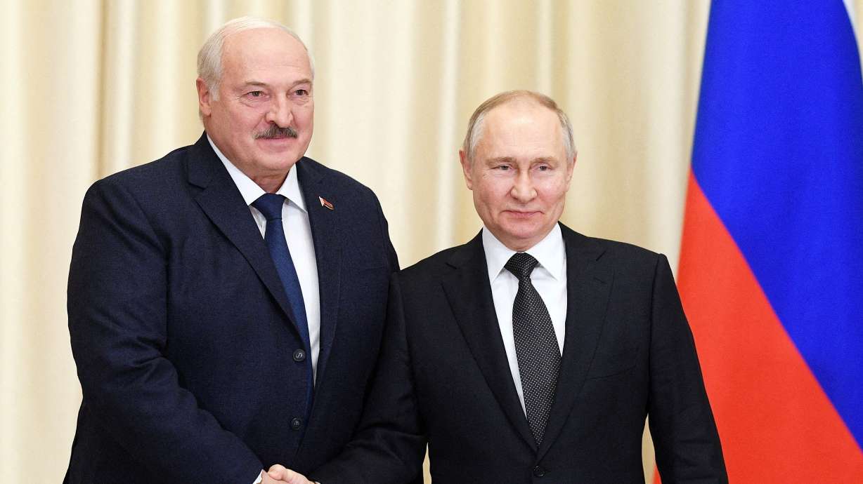 Russian President Vladimir Putin shakes hands with Belarusian President Alexander Lukashenko during a meeting at the Novo-Ogaryovo state residence outside Moscow, Russia Feb. 17.