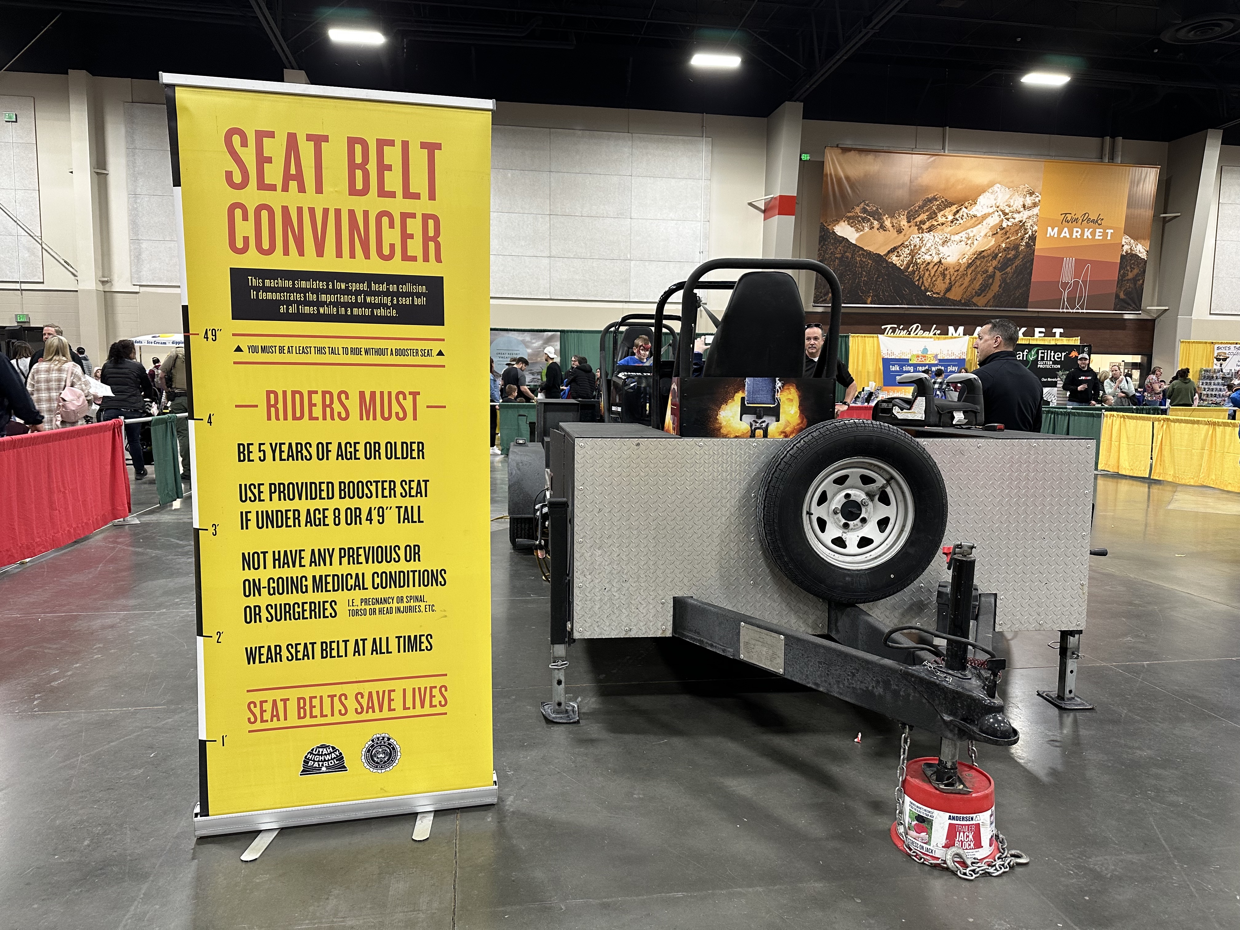 A Utah Highway Patrol collision simulator teaches the importance of seal belts at the Safe Kids Fair at Mountain America Exposition Center in Sandy on Saturday.