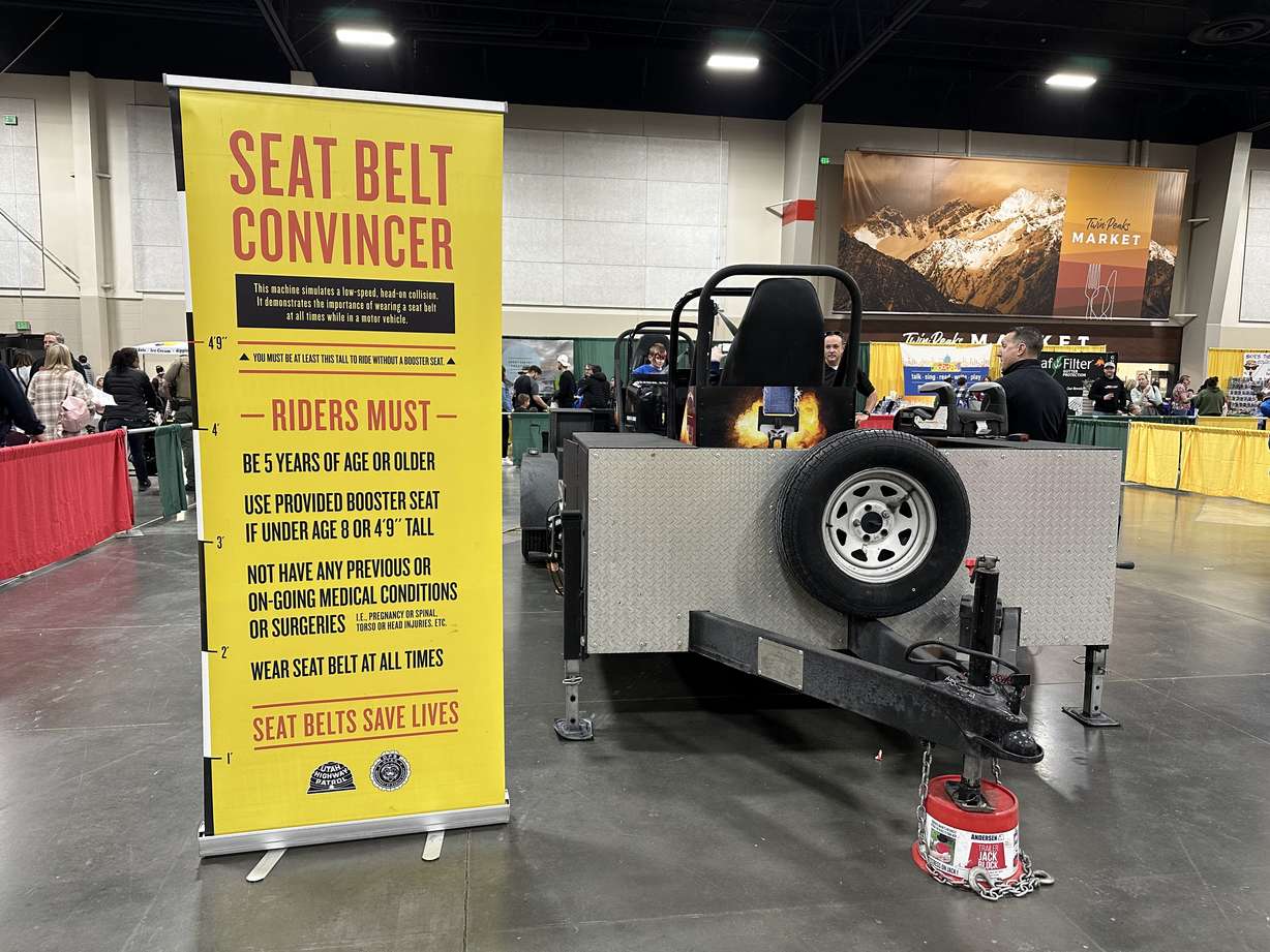 A Utah Highway Patrol collision simulator teaches the importance of seal belts at the Safe Kids Fair at Mountain America Exposition Center in Sandy on Saturday.