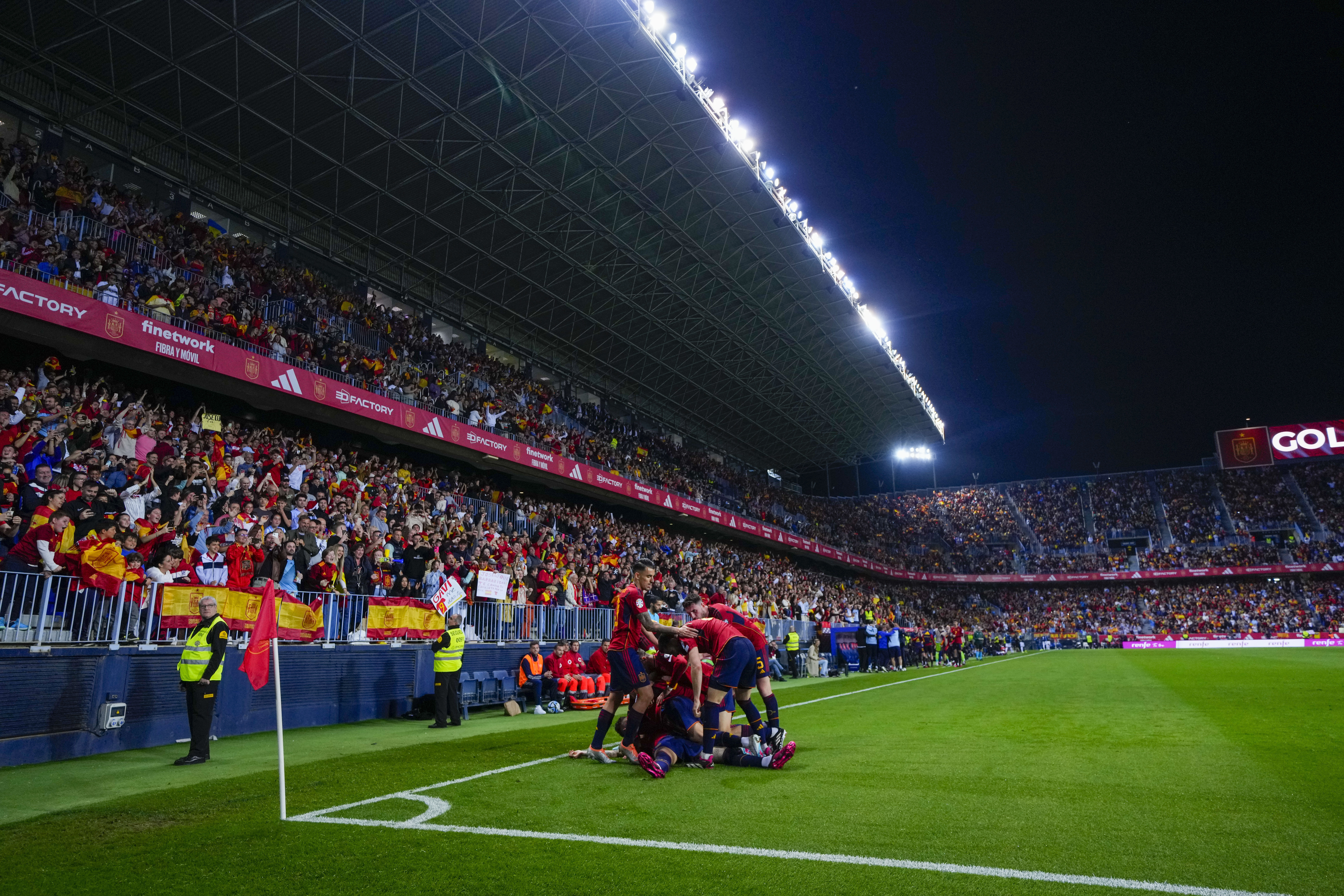 Spain's Joselu is congratulated after scoring his side's 2nd goal during the Euro 2024 group A qualifying soccer match between Spain and Norway at La Rosaleda stadium in Malaga, Spain, Saturday, March 25, 2023.