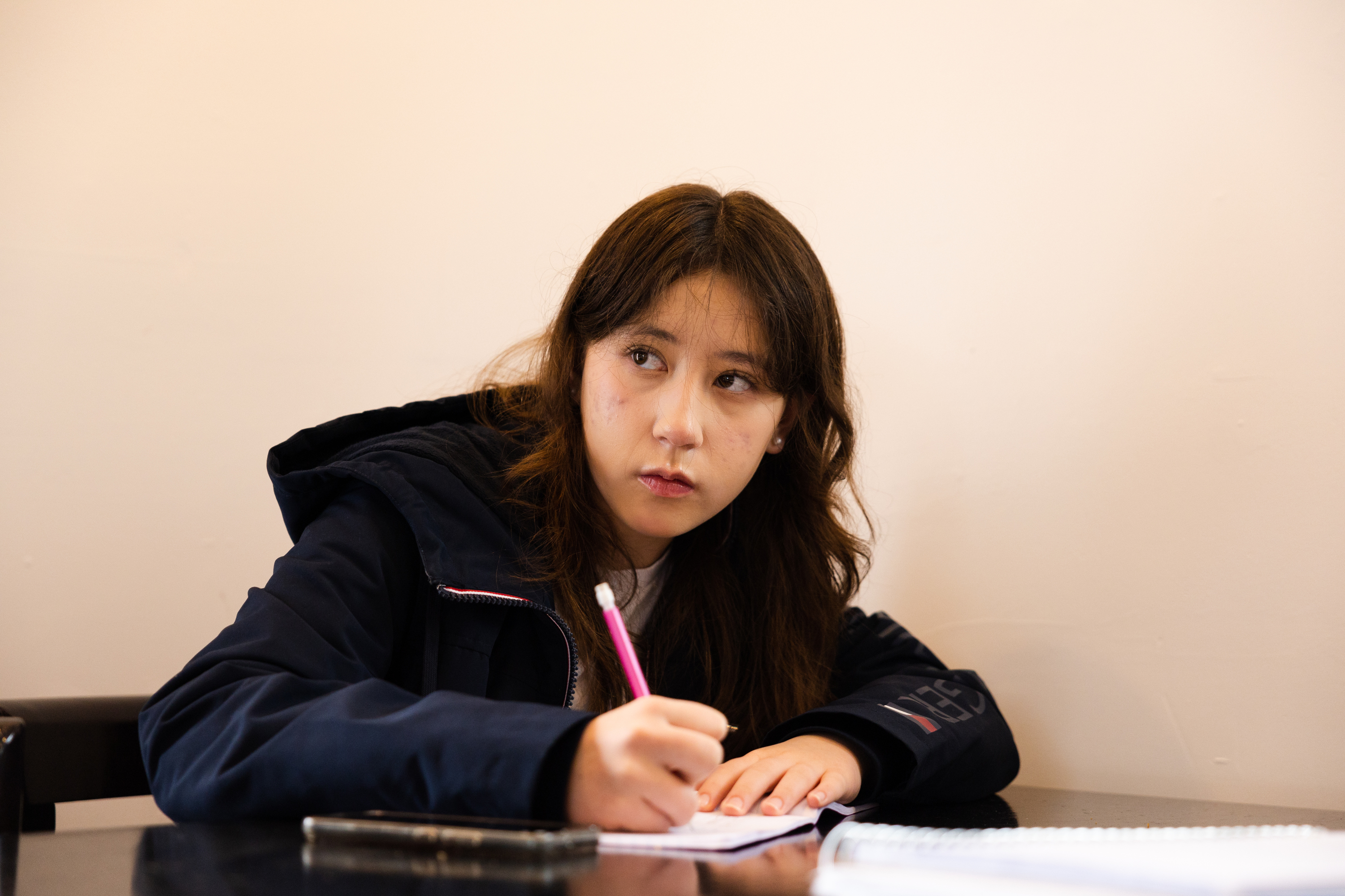 Katie Lens listens during a Korean language lesson at Yummy's Korean BBQ restaurant in West Valley City on March 25.
