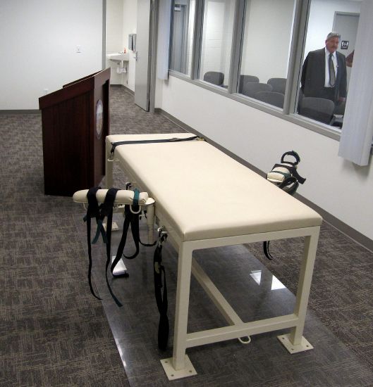 The execution chamber at the Idaho Maximum Security Institution is shown as Security Institution Warden Randy Blades looks on in Boise on Oct. 20, 2011. A bill that would allow Idaho to kill condemned inmates by firing squad was signed by the Idaho governor.