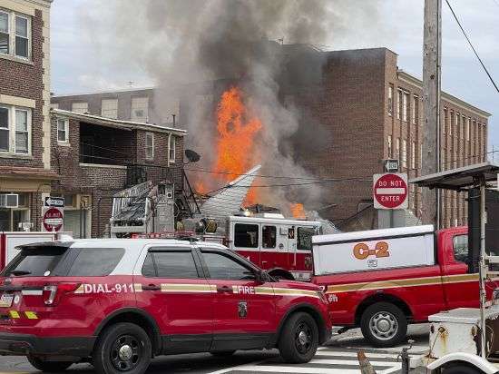 Emergency personnel work at the site of a deadly explosion at a chocolate factory in West Reading, Pennsylvania, Saturday.