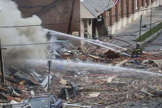 Emergency personnel work at the site of a deadly explosion at a chocolate factory in West Reading, Pennsylvania, Saturday.