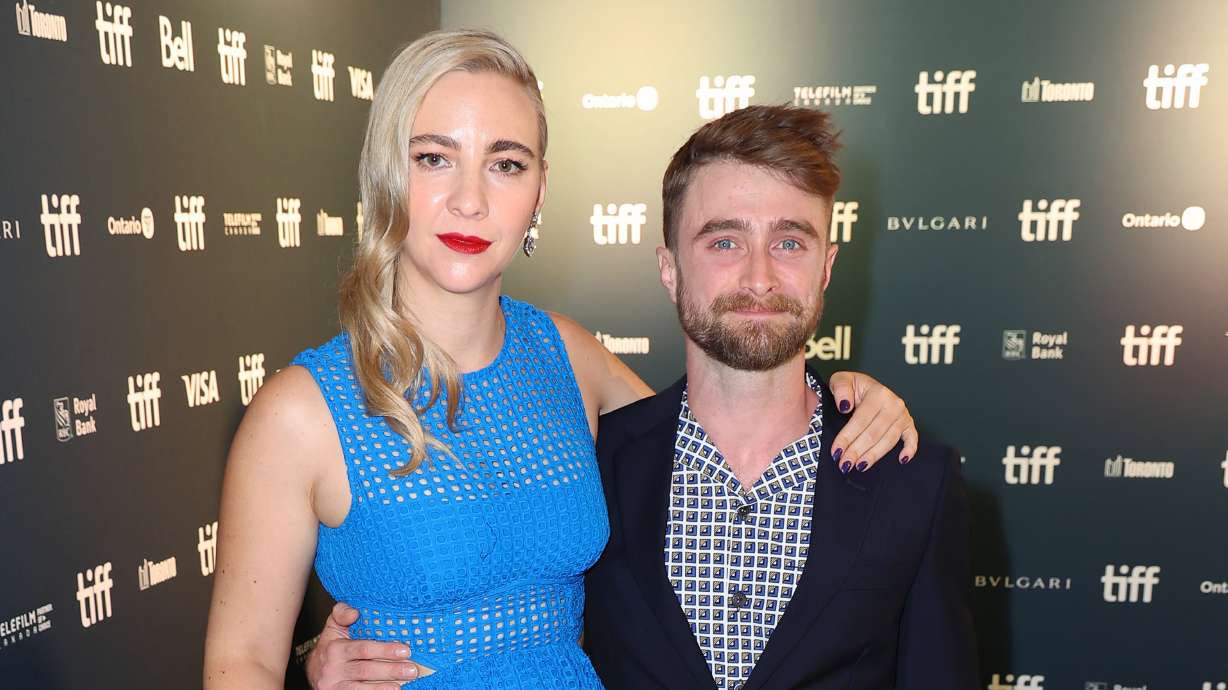 Erin Darke and Daniel Radcliffe at the 'Weird: The Al Yankovic Story' premiere in 2022 at the Toronto International Film Festival. Scott Boute, a representative for Radcliffe, said Sunday that the longtime couple is "expecting their first child."