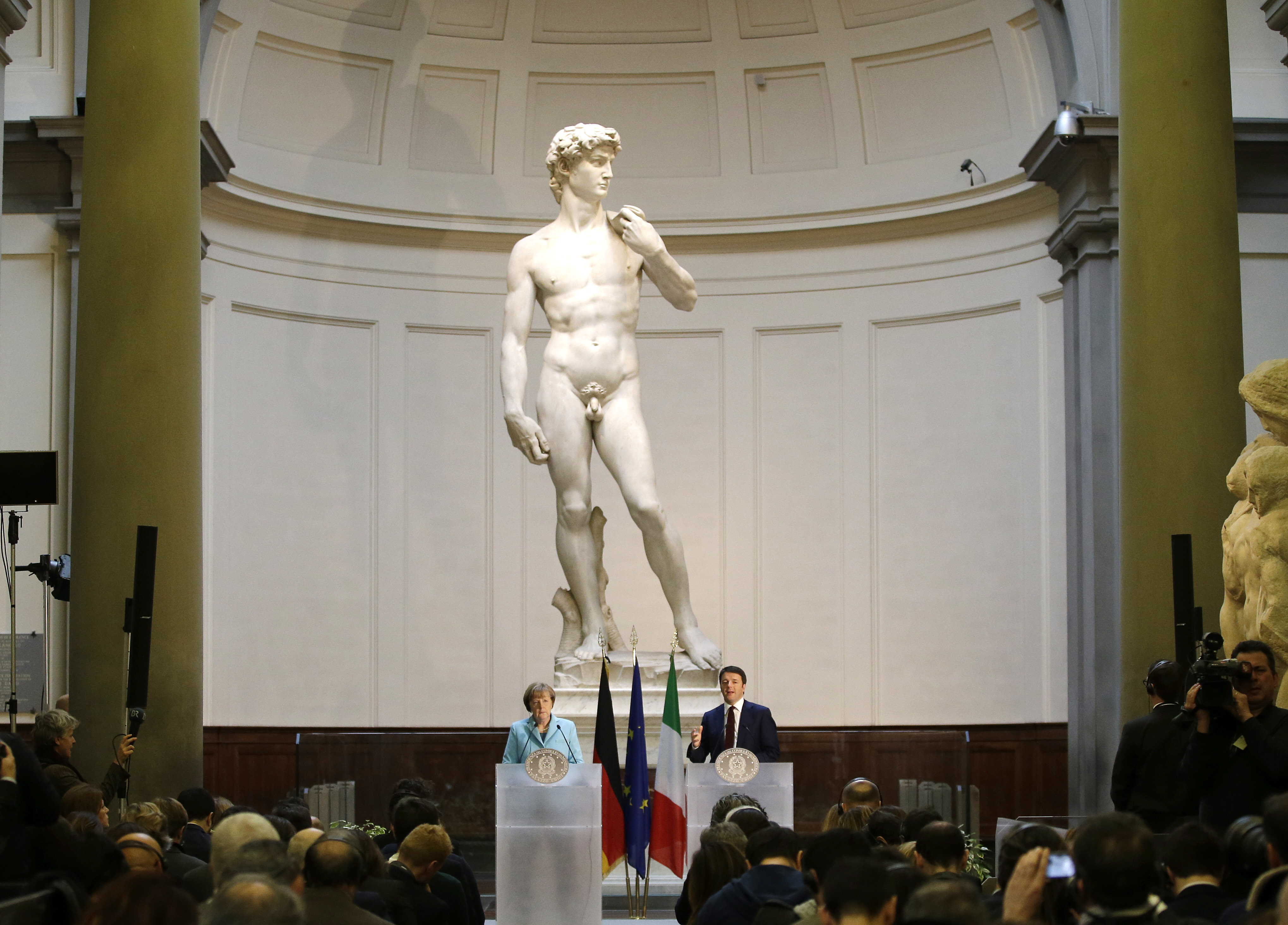 German Chancellor Angela Merkel, left, and Italian Prime Minister Matteo Renzi speak during a press conference in front of Michelangelo's "David statue" on Jan. 23, 2015. The head of Florence’s Galleria del’Accademia invited the parents and students of a Florida charter school to visit and see Michelangelo’s “David.”
