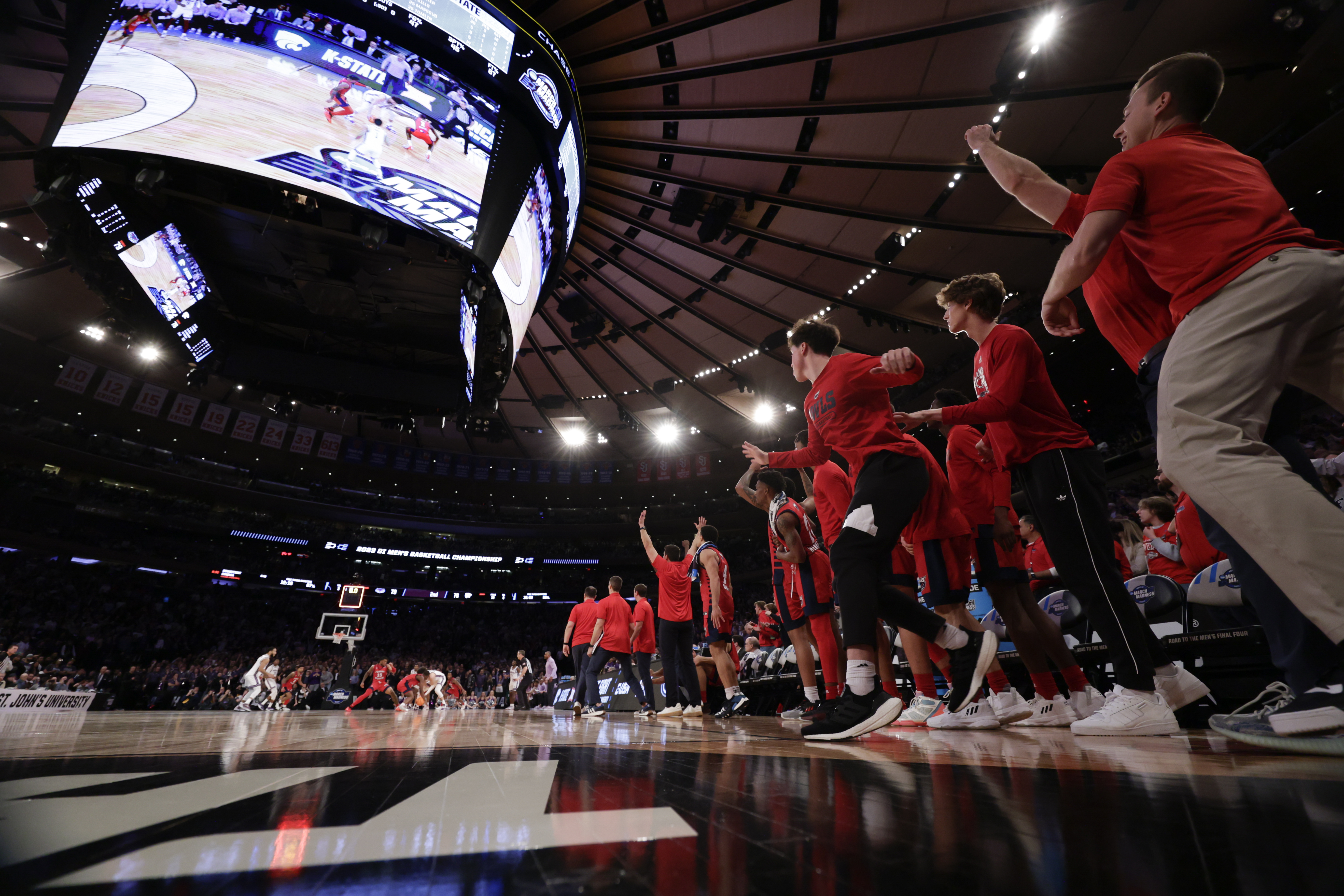 Florida Atlantic players celebrate after defeating Kansas State 79-76 in an Elite 8 college basketball game in the NCAA Tournament's East Region final, Saturday, March 25, 2023, in New York.