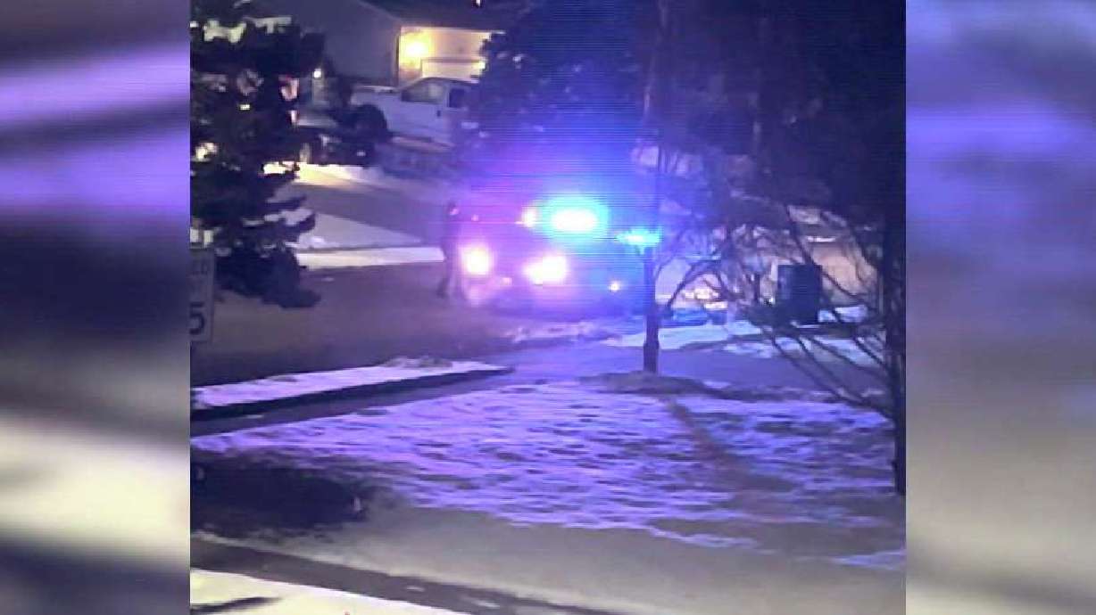 A neighbor's video Sunday shows police confronting a man on the street in Sandy. The man died after a resulting officer-involved shooting that morning.