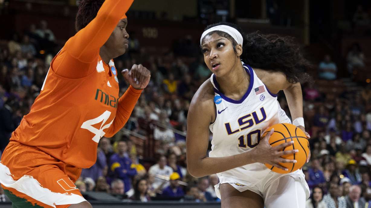 LSU's Angel Reese (10) goes up to shoot over Miami's Kyla Oldacre (44) in the first half of an Elite 8 college basketball game of the NCAA Tournament in Greenville, S.C., Sunday, March 26, 2023.