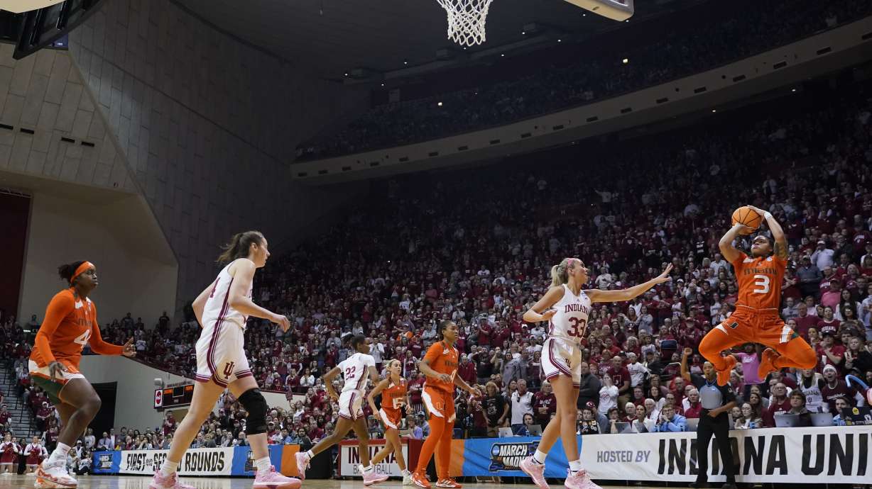 Miami's Destiny Harden (3) shoots against Indiana's Sydney Parrish (33) during the second half of a second-round college basketball game in the women's NCAA Tournament Monday, March 20, 2023, in Bloomington, Ind.