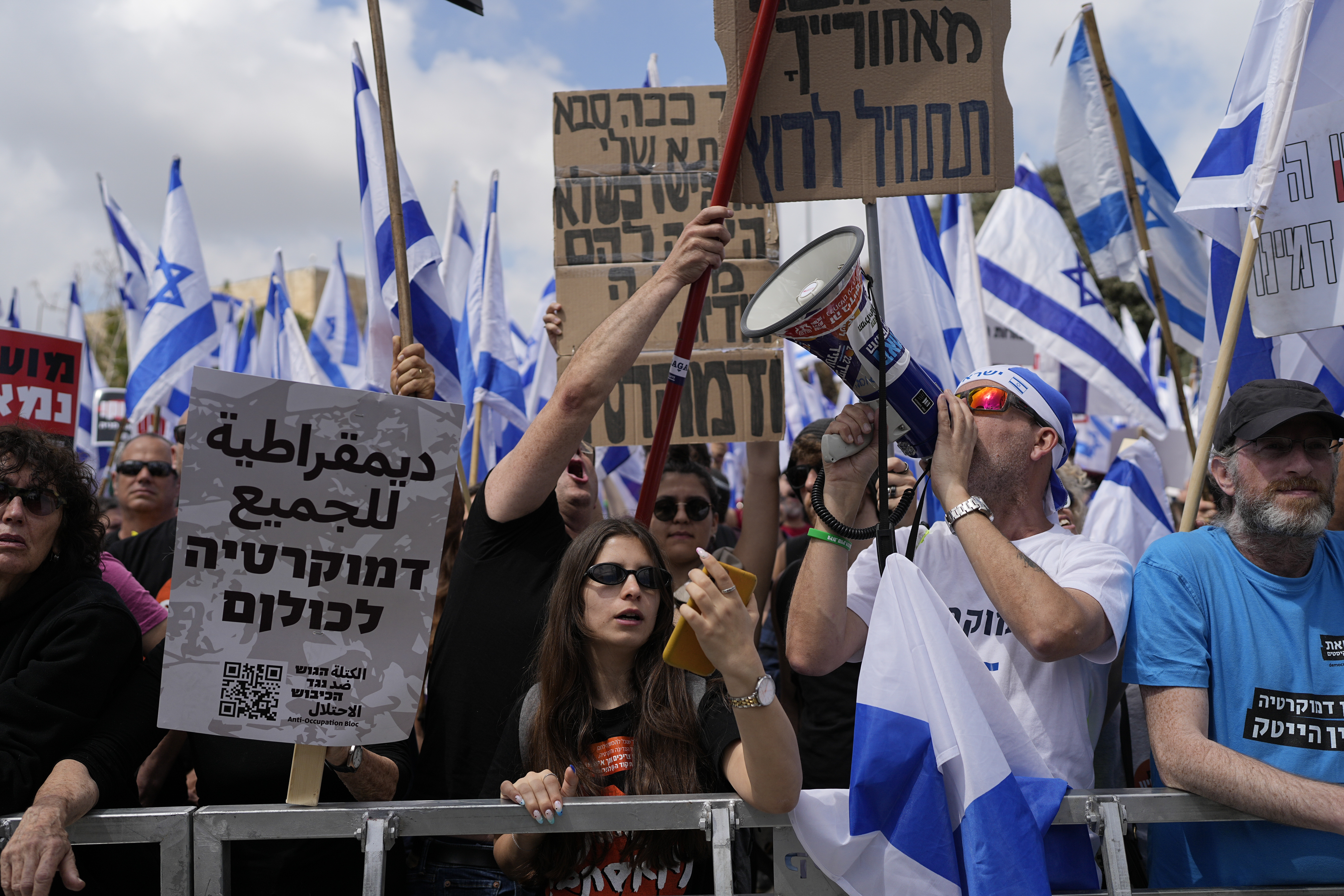 Israelis protest against Prime Minister Benjamin Netanyahu's judicial overhaul plan outside the parliament in Jerusalem, Monday.