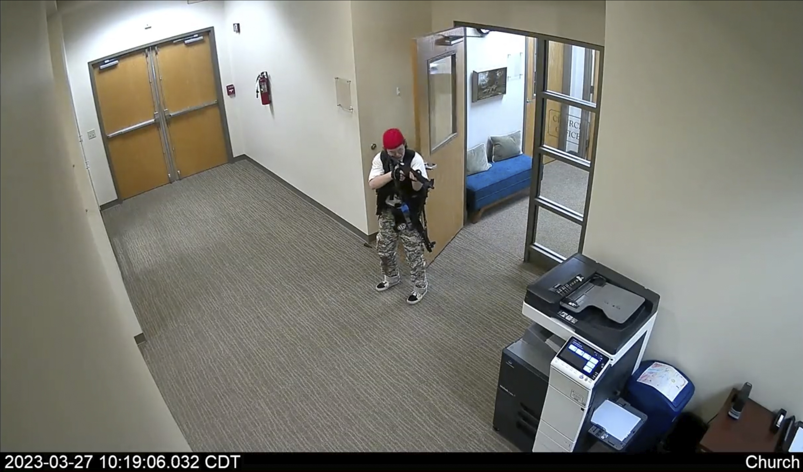 In this screen grab from surveillance video tweeted by the Metropolitan Nashville Police Department, Audrey Elizabeth Hale points an assault-style weapon inside The Covenant School in Nashville, Tenn., Monday.