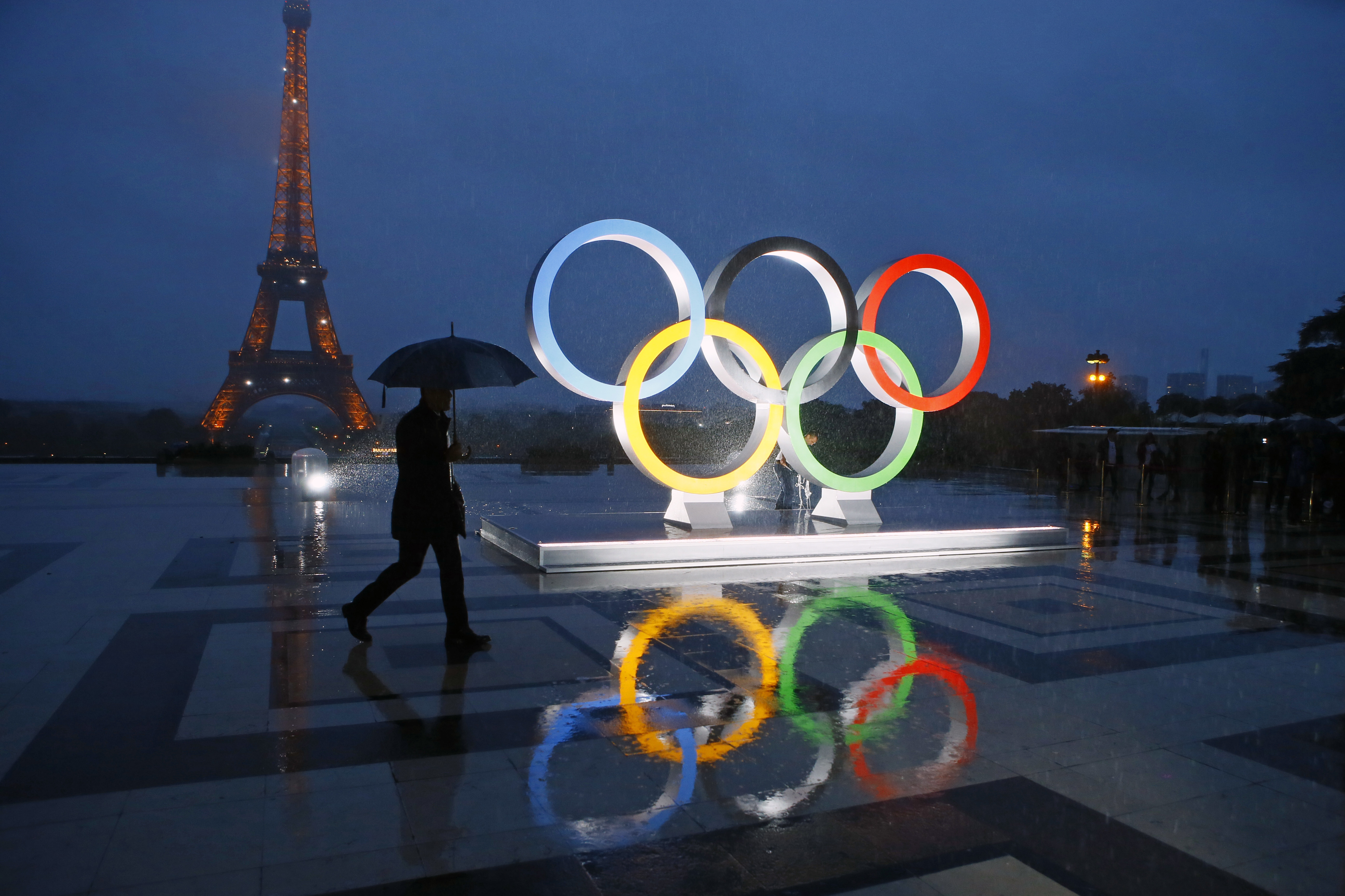 FILE - A display of the Olympic rings is set up on Trocadero plaza that overlooks the Eiffel Tower, after the vote in Lima, Peru, awarding the 2024 Games to the French capital, in Paris, France, Wednesday, Sept. 13, 2017. A proposed French law for the 2024 Paris Olympics that critics contend will open the door for privacy busting video surveillance technology in France and elsewhere in Europe faces an important hurdle Tuesday March 28, 2023 with lawmakers set to vote on it. The bill would legalize the temporary use of so-called "intelligent" surveillance systems to safeguard the Games and Paralympics.