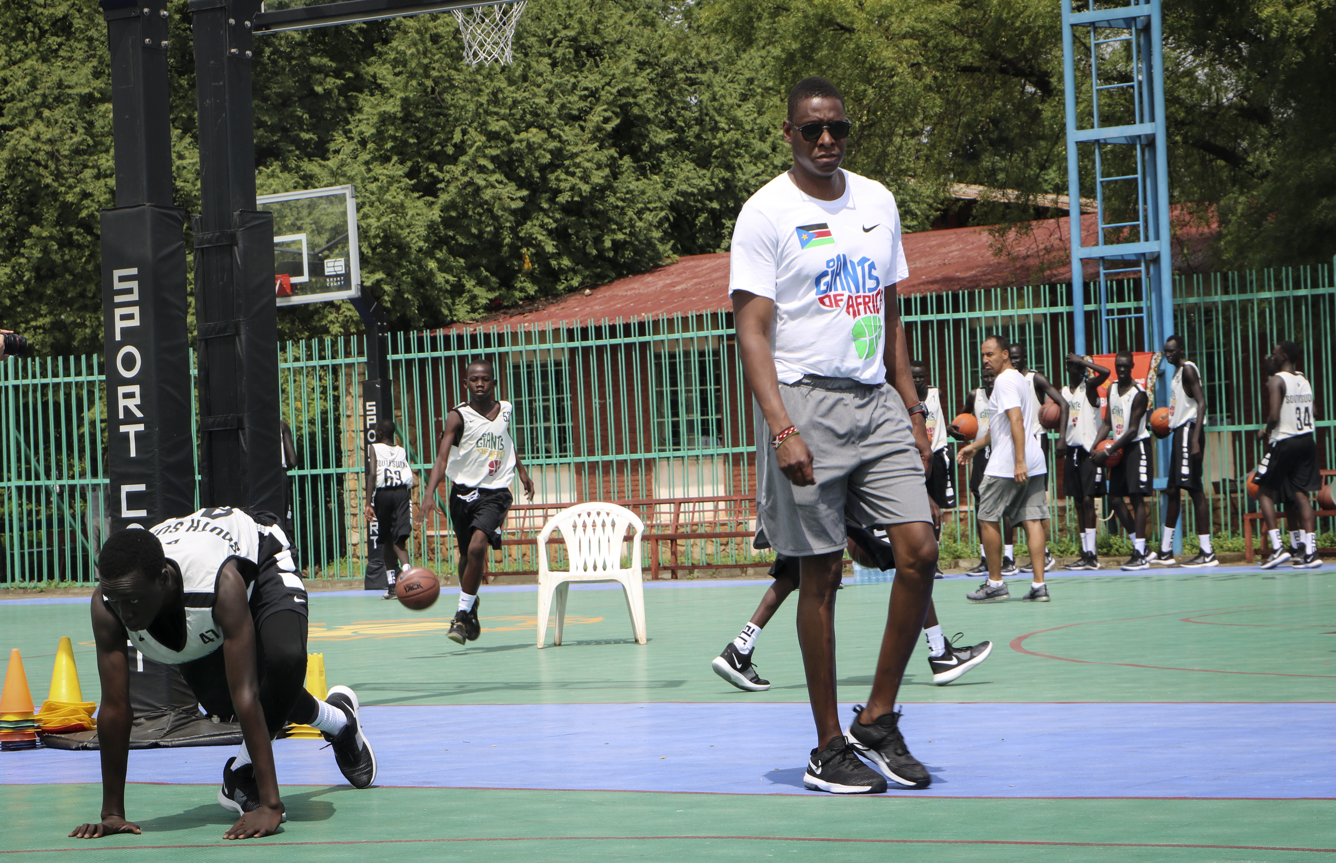 FILE - Masai Ujiri walks on the basketball court during a three-day basketball training camp run by Giants of Africa in Juba, South Sudan on Aug. 20, 2019. Several prospects from the NBA Academy in Africa are playing in the new season of the Basketball Africa League. Now in its third season, the league was created by the NBA in partnership with FIBA to help grow the sport in Africa.