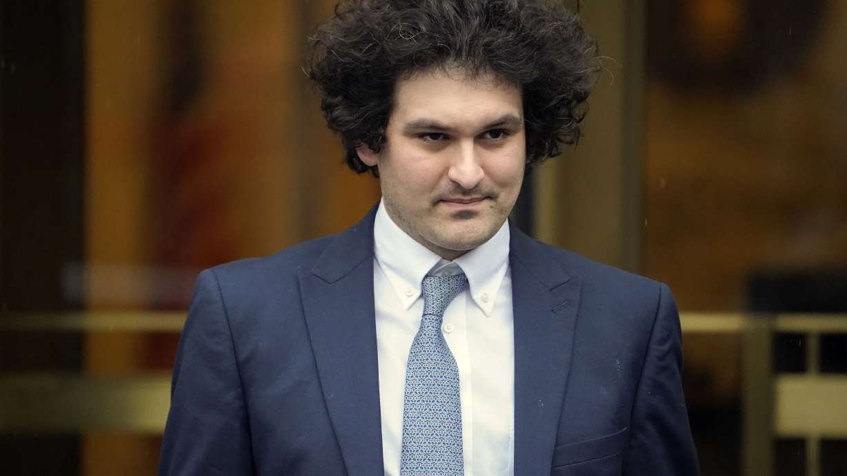 FTX founder Sam Bankman-Fried leaves Manhattan federal court in New York, Feb. 16. On Tuesday, Bankman-Fried is accused in new indictment of paying a $40 million bribe to unlock frozen crypto in China.