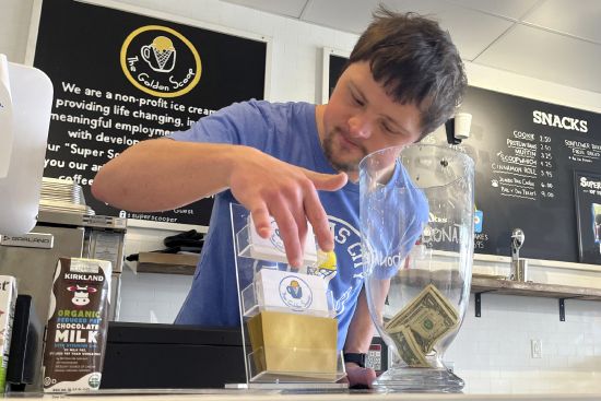 Patrick Chapman, 27, prepares for customers March 2 at The Golden Scoop, an Overland Park, Kansas, ice cream and coffee shop that employs workers with developmental disabilities, paying them more than minimum wage. But some disabled workers employed at so-called sheltered workshops are earning far less than minimum wage.