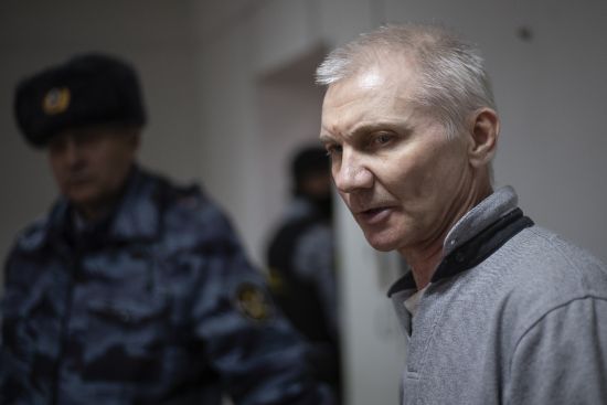 Alexei Moskalyov, right, is escorted from a courtroom in Yefremov, Tula region, some 186 miles south of Moscow, Russia, Monday. A court in Russia on Tuesday convicted a single father over social media posts criticizing the war in Ukraine and sentenced him to two years in prison.