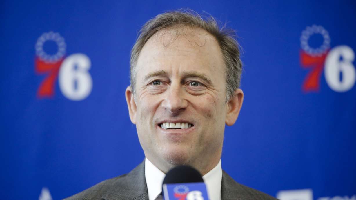FILE - Philadelphia 76ers owner Josh Harris speaks with members of the media during a news conference at the NBA basketball team's practice facility in Camden, N.J., Tuesday, May 14, 2019. Two people with knowledge of the situation tells The Associated Press a group led by Josh Harris and Mitchell Rales has submitted a fully financed bid for the NFL's Washington Commanders. The Harris/Rales group, which includes basketball Hall of Famer Magic Johnson, is one of multiple bidders involved in the sale process .