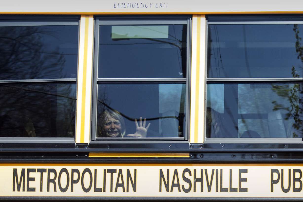 A child weeps while on the bus leaving the Covenant School following a mass shooting at the school in Nashville, Tenn., Monday.