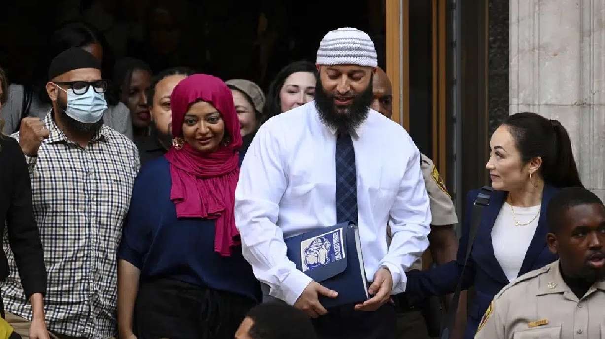Adnan Syed, center right, leaves the courthouse after a hearing on Sept. 19, 2022, in Baltimore. On Tuesday, a Maryland appellate court reinstated the conviction of Syed.