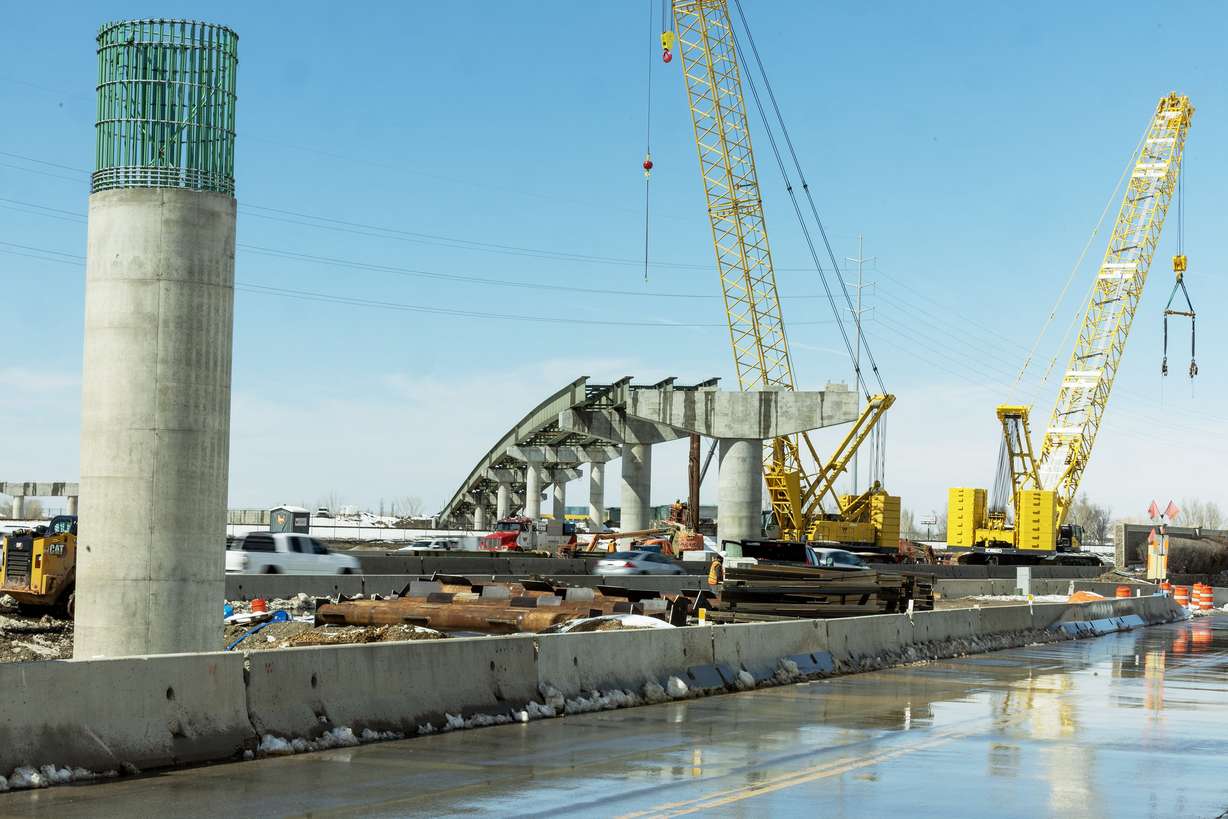 Workers construct a bridge over I-15 on the West Davis Corridor near Farmington on Tuesday. A wild wintry storm last weekend forced the Utah Department of Transportation to call off a planned closure of southbound I-15 from Parrish Lane to Park Lane in Davis County out of concern for workers' safety.