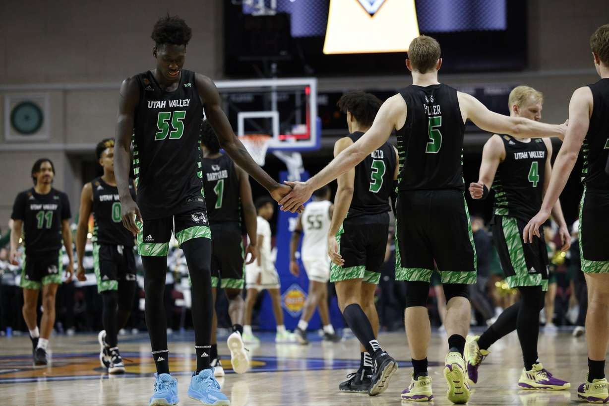 Utah Valley teammates Aziz Bandaogo and Tim Fuller slap palms during an NIT semifinal game against UAB, Tuesday, March 29, 2023 at Orleans Arena in Las Vegas.