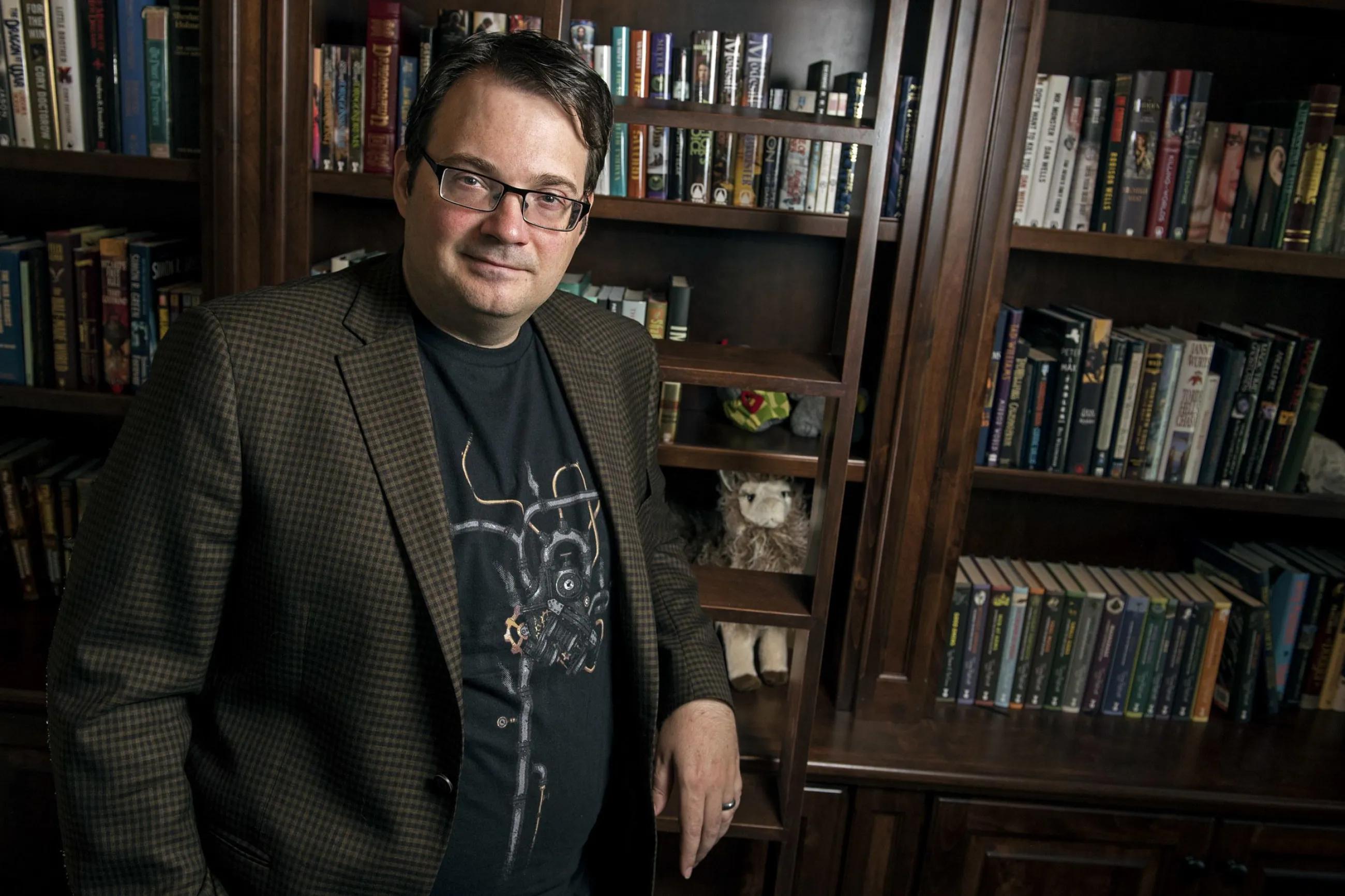 Brandon Sanderson poses for a portrait at his home in American Fork, Utah, in 2019.