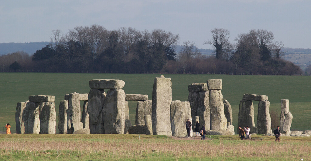 Visitors are dwarfed by the Stonehenge monument in England, Jan. 31, 2007. In a paper published last Thursday in the journal Antiquity which suggested Stonehenge's massive sandstone blocks known as "sarsens" corresponded to a calendar keeping track of a year lasting 365.25 days.