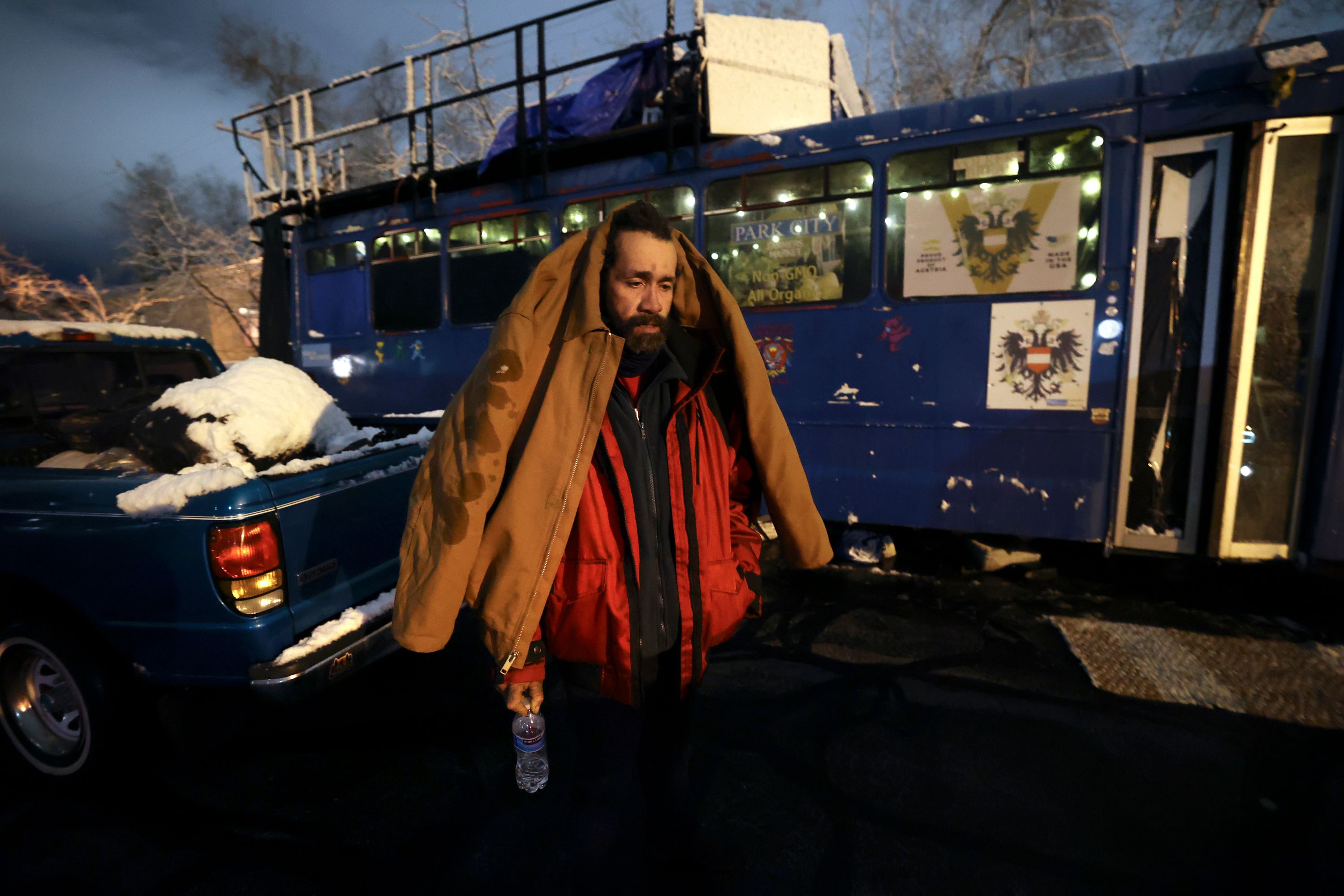 Mike “Trigger” Garcia, who is unsheltered, suffers from a four-day-long headache outside of the Nomad Alliance bus, temporarily parked outside a meetinghouse of The Church of Jesus Christ of Latter-day Saints that is not in use on March 8.