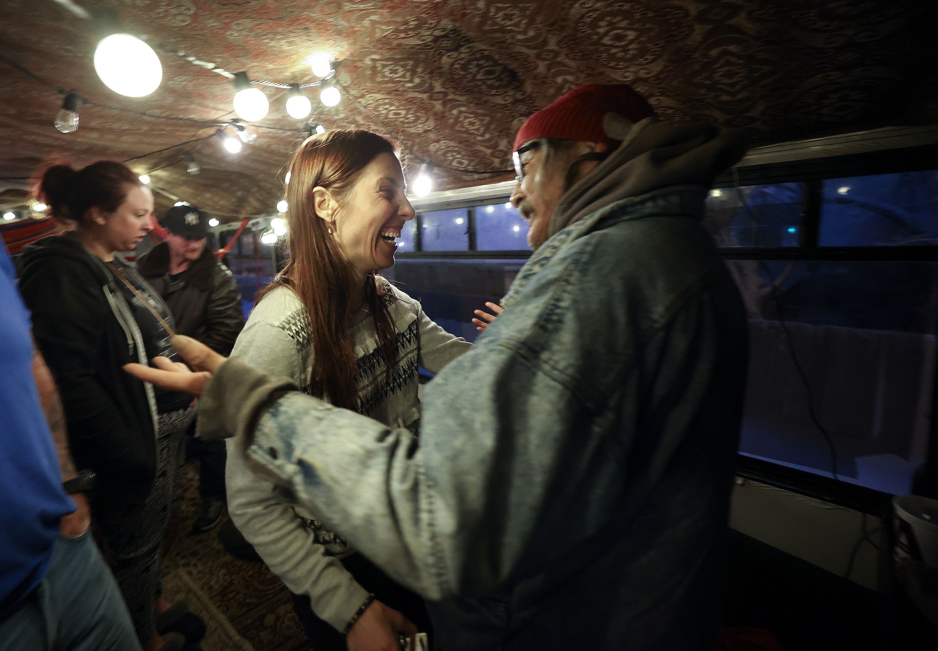 Kseniya Kniazeva, Nomad Alliance founder, reacts as AJ Lonewolf returns to the Nomad Alliance bus, temporarily parked outside a meetinghouse of The Church of Jesus Christ of Latter-day Saints that is not in use on March 8. Lonewolf left earlier that day to take a bus to Vernal for hernia surgery. After hours of waiting, the bus to Vernal never showed up so Lonewolf returned to the Nomad Alliance bus to sleep for the night before trying again the next day.
