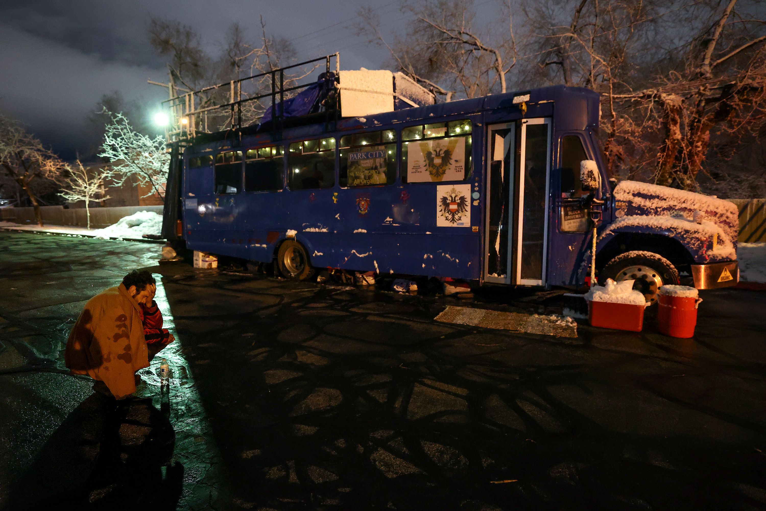 Mike “Trigger” Garcia, who is unsheltered, suffers from a four-day long headache outside of the Nomad Alliance bus, temporarily parked outside a meetinghouse of The Church of Jesus Christ of Latter-day Saints that is not in use on March 8.