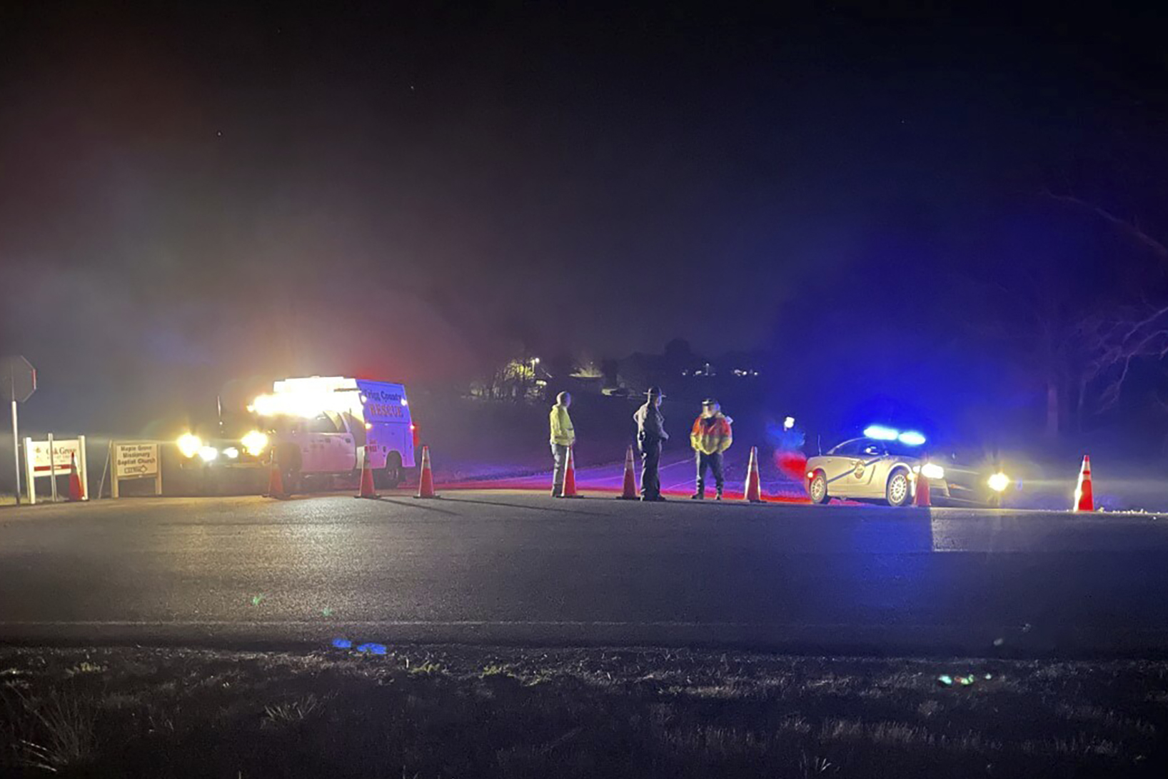 Emergency responders are seen near a site where two military helicopters crashed Wednesday night during a routine training mission in Trigg County, in southwestern Kentucky, on Thursday.