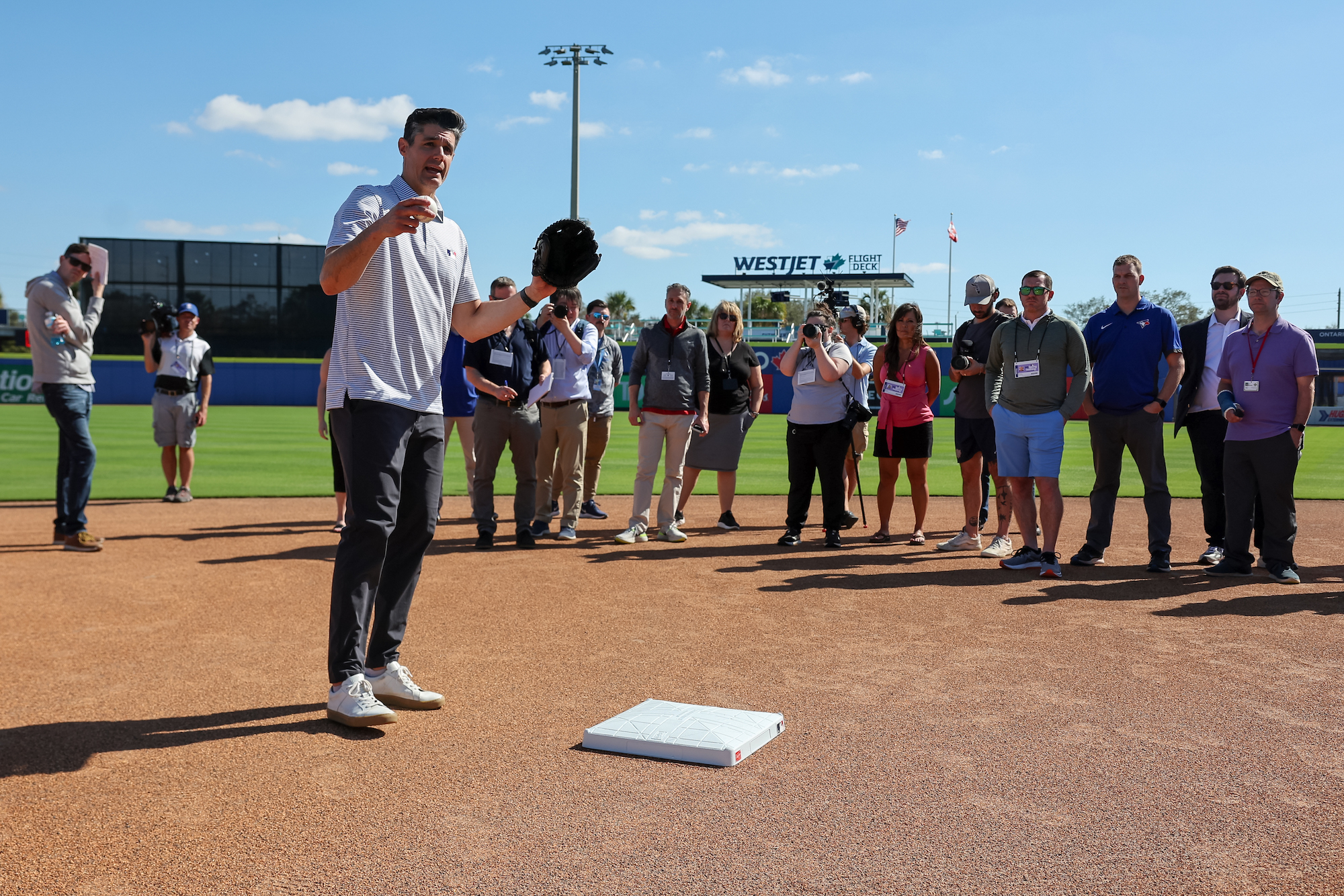 Joe Martinez, vice President of On-Field Strategy for Major League Baseball, explains new rule changes to assembled media during the On-Field Rules Demonstration at TD Ballpark in Dunedin, Florida.