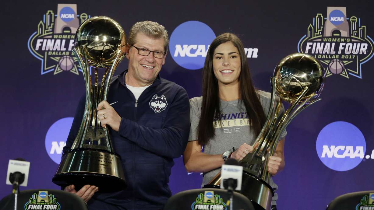FILE - Connecticut head coach Geno Auriemma, left, and Washington's Kelsey Plum, right, hold their respective trophies after they were named The Associated Press Women's Basketball Coach of the Year and AP Women's Player of the Year at the women's NCAA Final Four college basketball tournament, Thursday, March 30, 2017, in Dallas. The Associated Press will announce the men’s and women's college basketball player and coach of the year awards this week. The women's awards will be announced on Thursday, March 30, 2023, the men's on Friday.