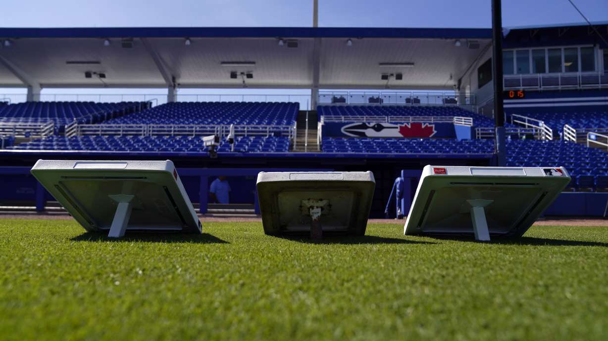 The new, larger base sits next to the older, smaller base at TD Ballpark Wednesday, Feb. 15, 2023, in Dunedin, Fla. Opening day will feature three of the biggest changes in baseball since 1969: Two infielders will be required to be on either side of second base, base size will increase to 18-inch squares from 15 and a pitch clock will be used.