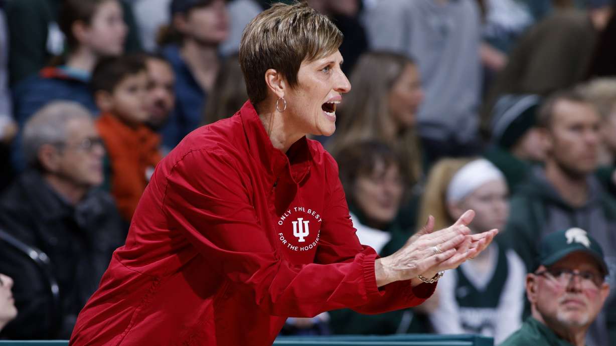 FILE - Indiana coach Teri Moren applauds during the first half of the team's NCAA college basketball game against Michigan State on Thursday, Dec. 29, 2022, in East Lansing, Mich. Moren was honored Thursday, March 30, 2023, as The Associated Press women's college basketball Coach of the Year.