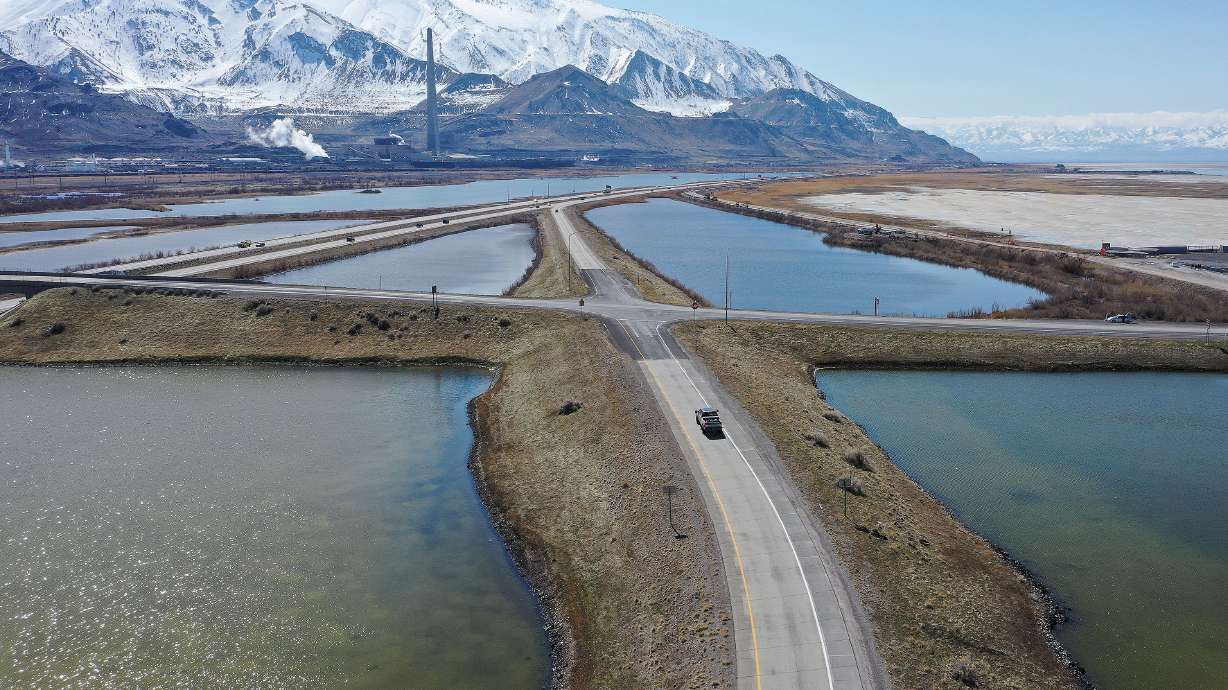 Motorists drive on I-80 near the Great Salt Lake in Salt Lake City on March 17. The lake has risen by over 2 feet in the past few months from storms that have also weakened Utah's ongoing drought.