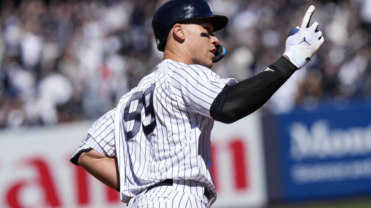 New York Yankees' Aaron Judge reacts after hitting a solo home run during the first inning of a baseball game against the San Francisco Giants at Yankee Stadium Thursday, March 30, 2023, in New York.