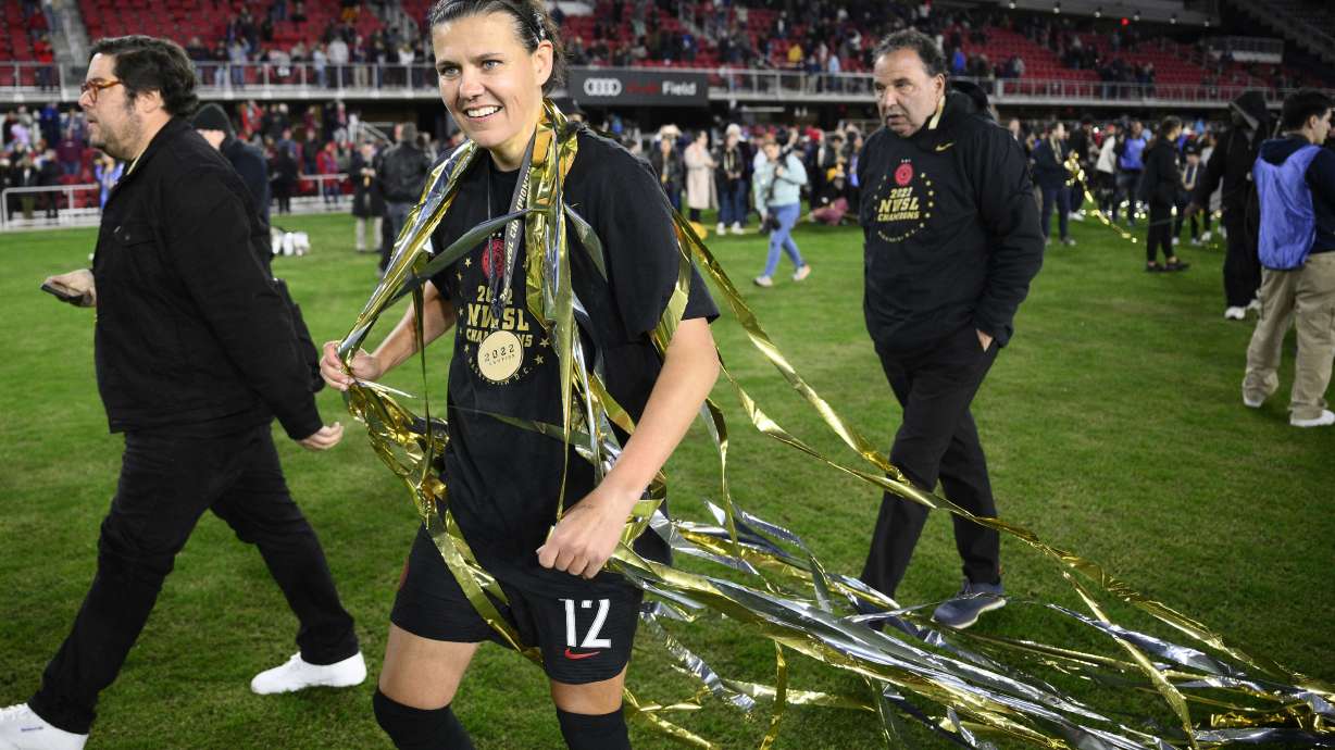 FILE - Portland Thorns FC forward Christine Sinclair (12) celebrates after the NWSL championship soccer match against the Kansas City Current, Saturday, Oct. 29, 2022, in Washington. The Portland Thorns' Christine Sinclair is one of just five players who helped launch the National Women's Soccer League in 2013 and are still with their same teams.
