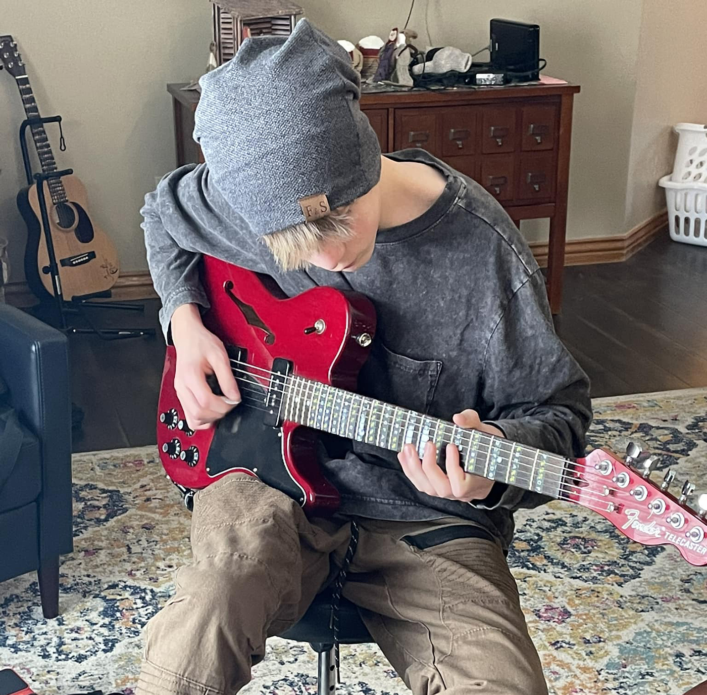 UOS middle school guitarist focuses on his craft while earning high school credits