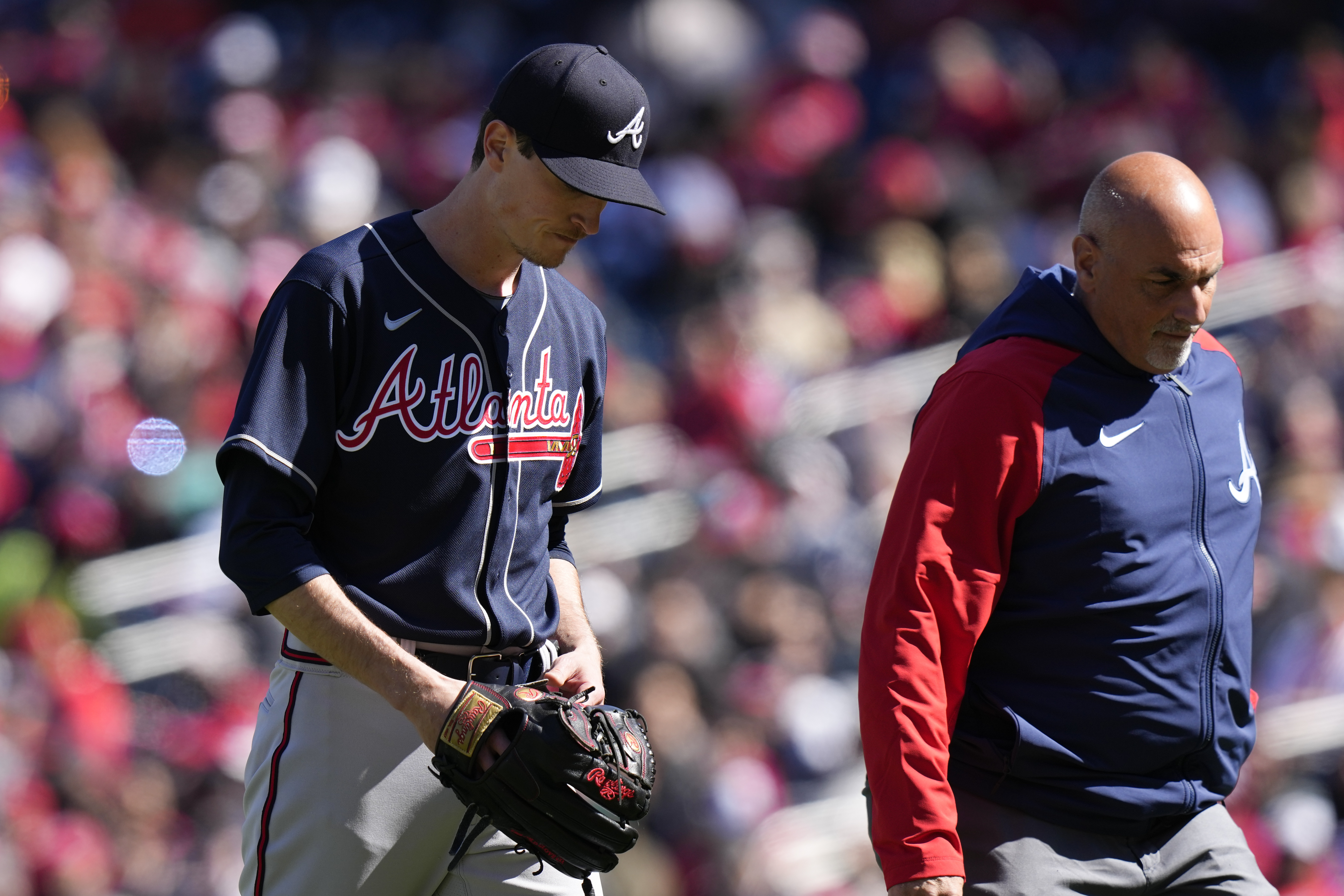 Atlanta Braves starting pitcher Max Fried, left, walks off the field during the fourth inning of an opening day baseball game against the Washington Nationals at Nationals Park, Thursday, March 30, 2023, in Washington.