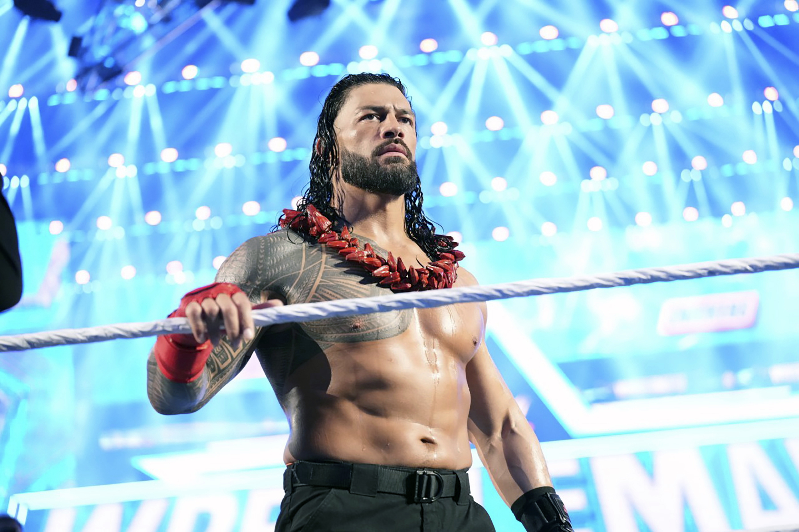Roman Reigns enters the ring to face Brock Lesnar during WrestleMania 38 in Arlington Texas, April 3, 2022. Reigns and Cody Rhodes will be in the main event of WrestleMania 39 on April 2, 2023, in Los Angeles. 